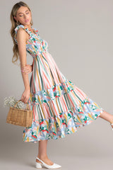 This multi-colored dress features a square neckline, smocked straps, a fully smocked bust section, functional pockets at the hips, and a flowy skirt.