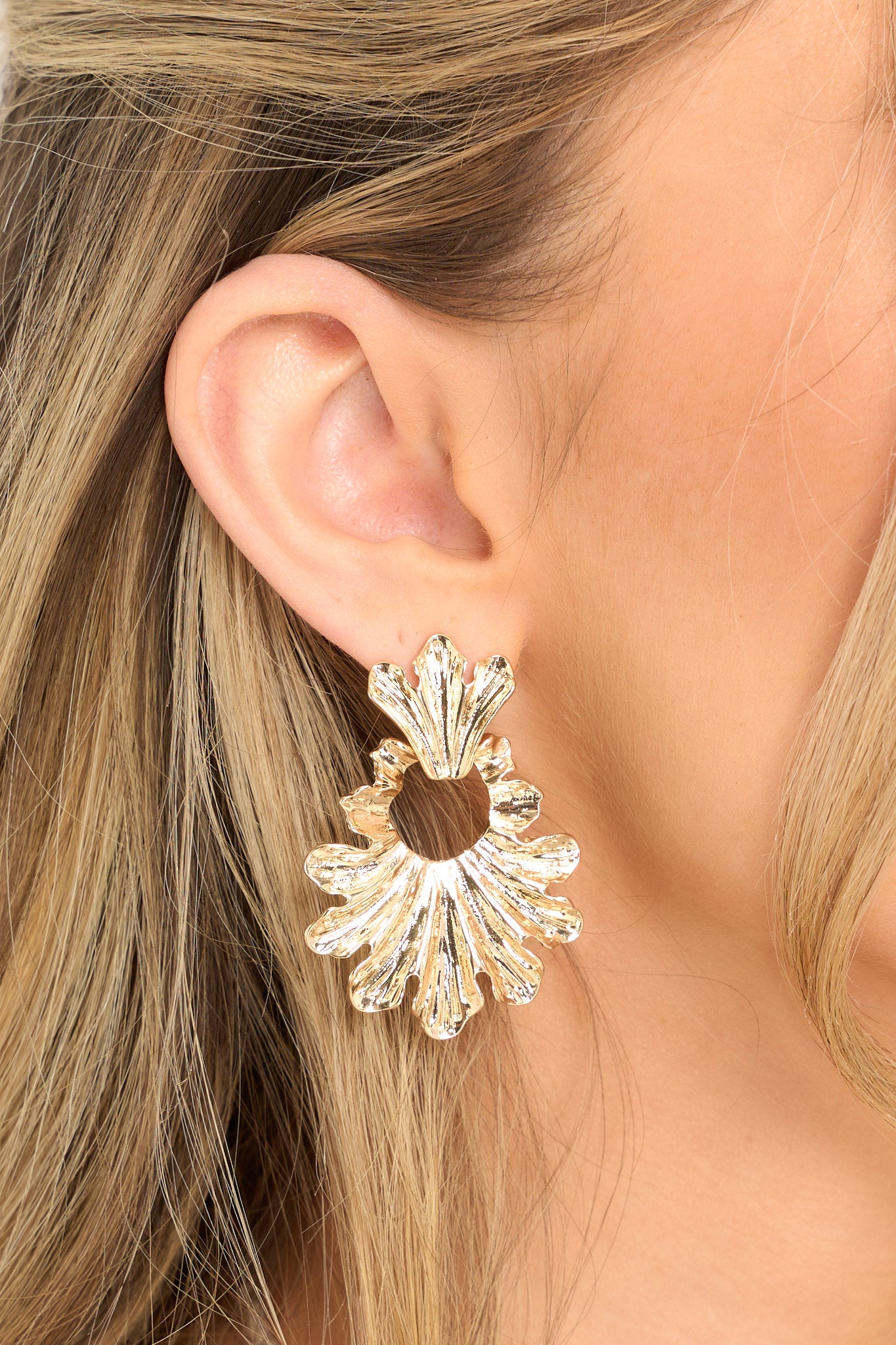 These gold earrings feature gold hardware, an extremely unique & intricate design, and secure post backings.