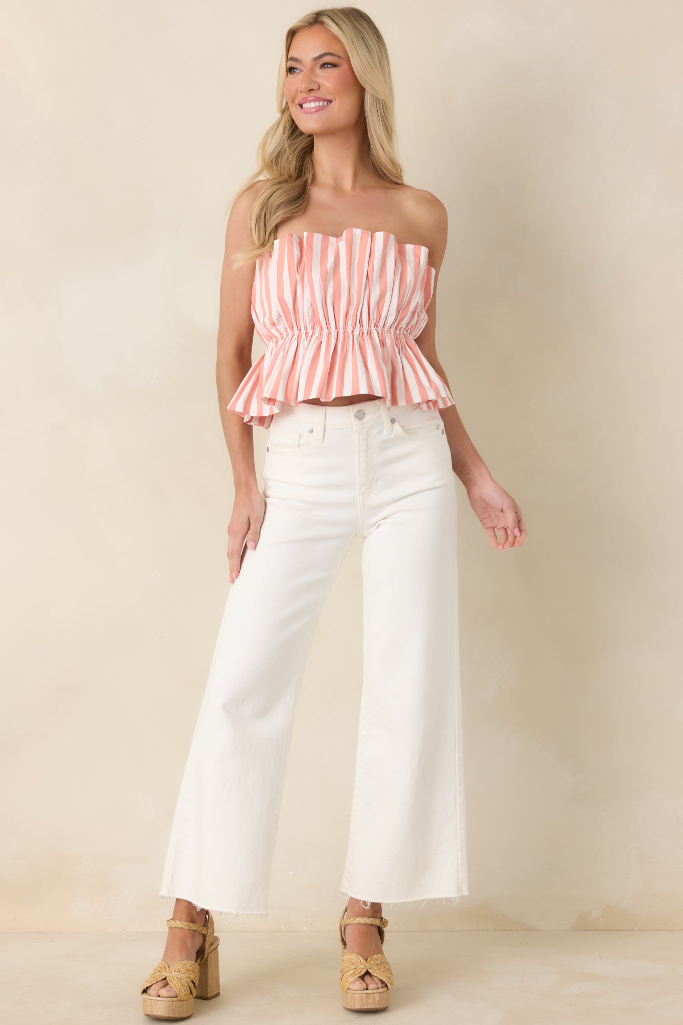 Strapless bandeau with a softly fitted elastic body and secure top edge for confident, stay-put wear.