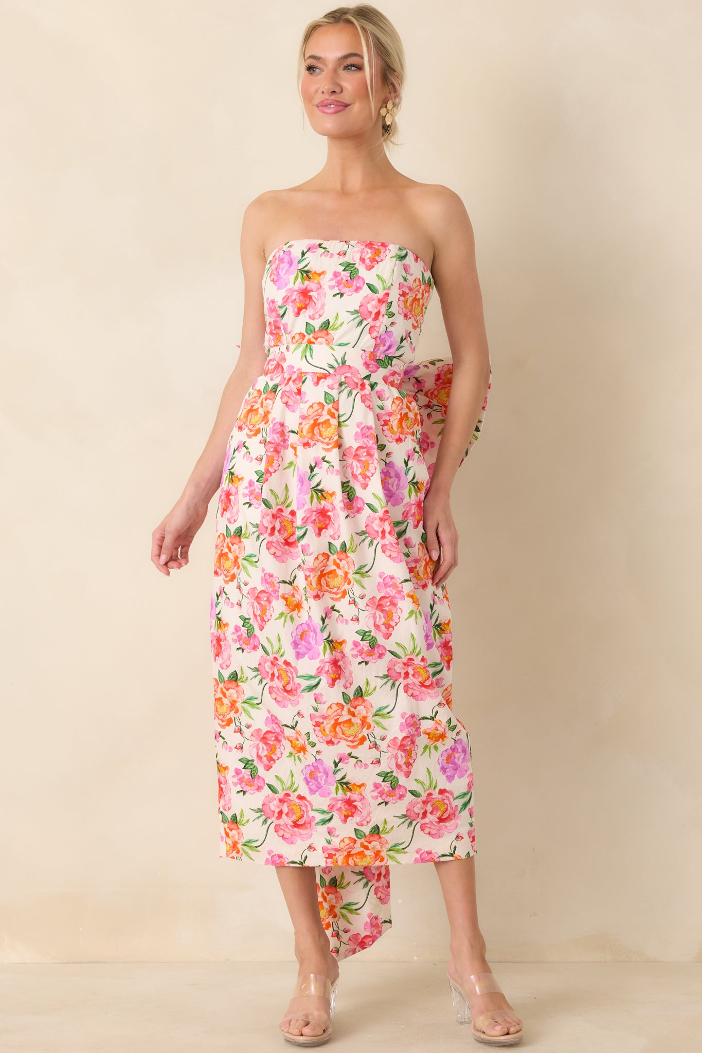 Multi floral pink midi dress with strapless design, fitted bodice, and smooth skirt offering a polished, elegant silhouette.