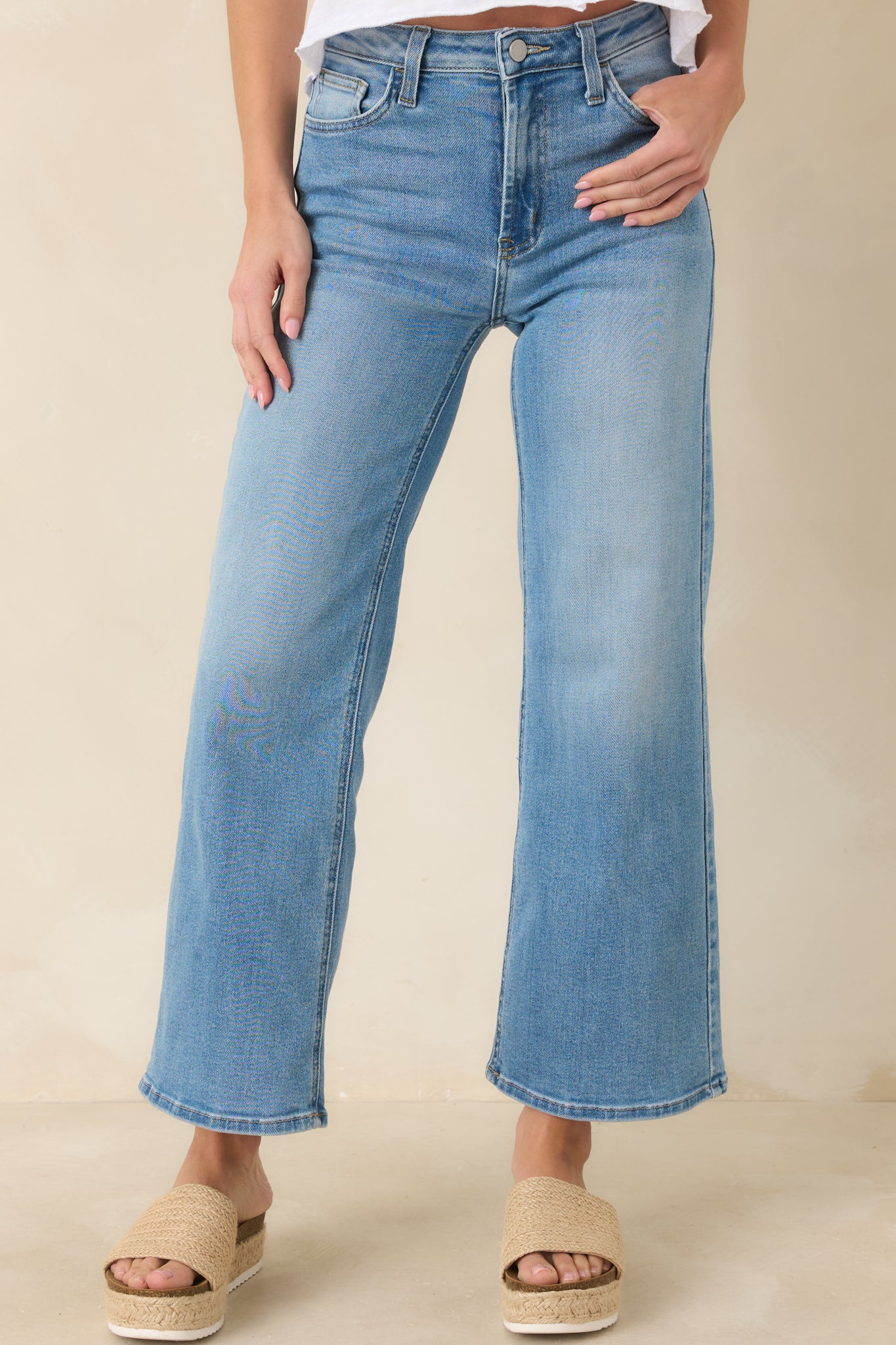 Closer angle emphasizing slightly cropped hem, light wash finish, and functional pocket stitching.