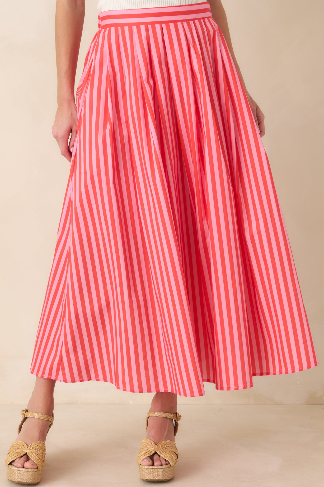 Cotton maxi skirt highlighting the clean waistband and softly structured woven texture.