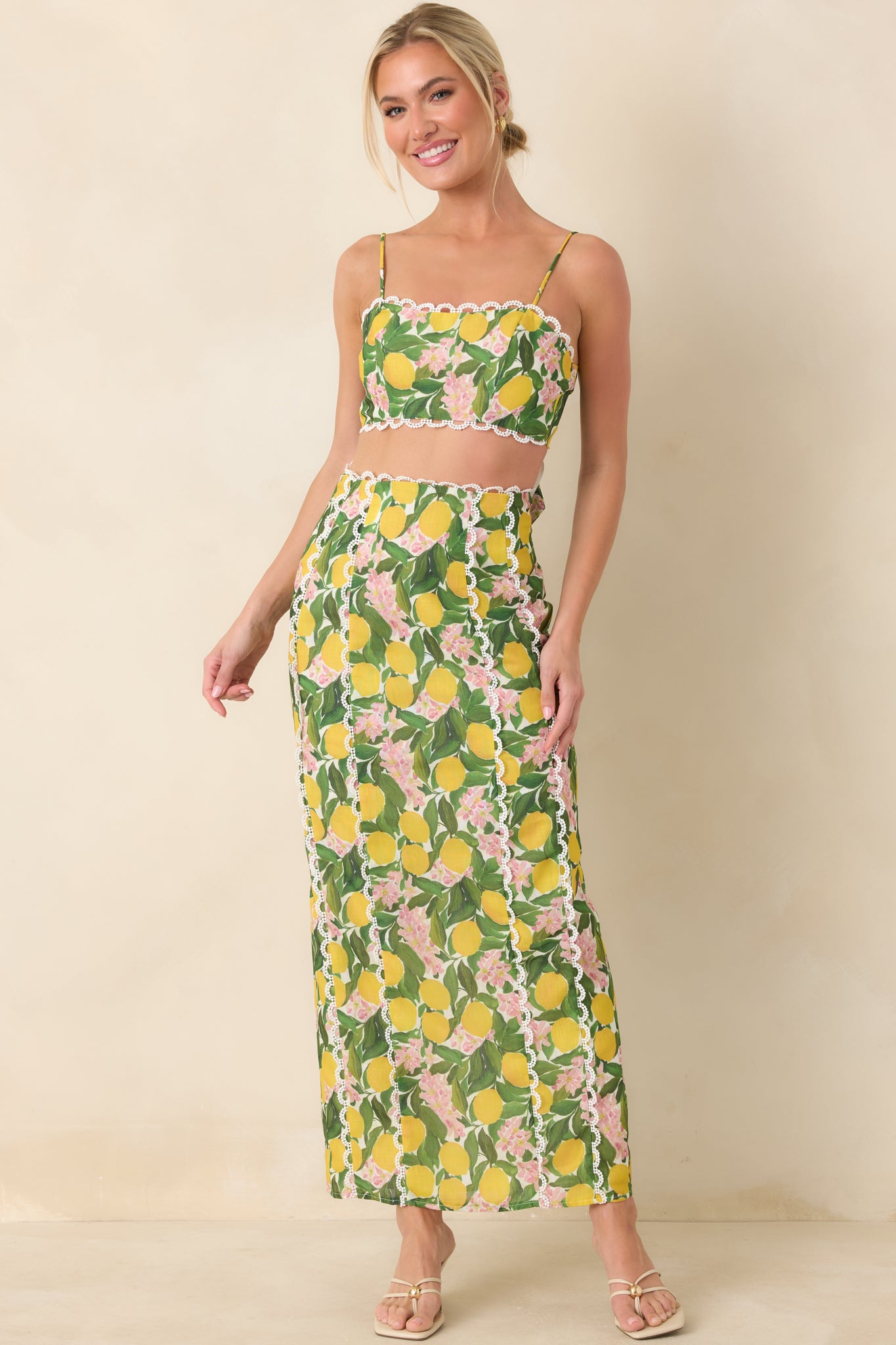 Straight-cut high-rise maxi skirt in yellow with lemon print, subtle lace trim detailing, and a lightweight woven construction for breezy comfort.