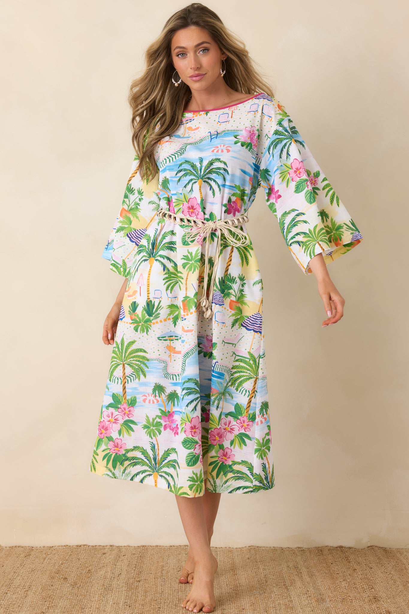 Flowy caftan dress with tropical motifs including palm trees, umbrellas, and seaside details.