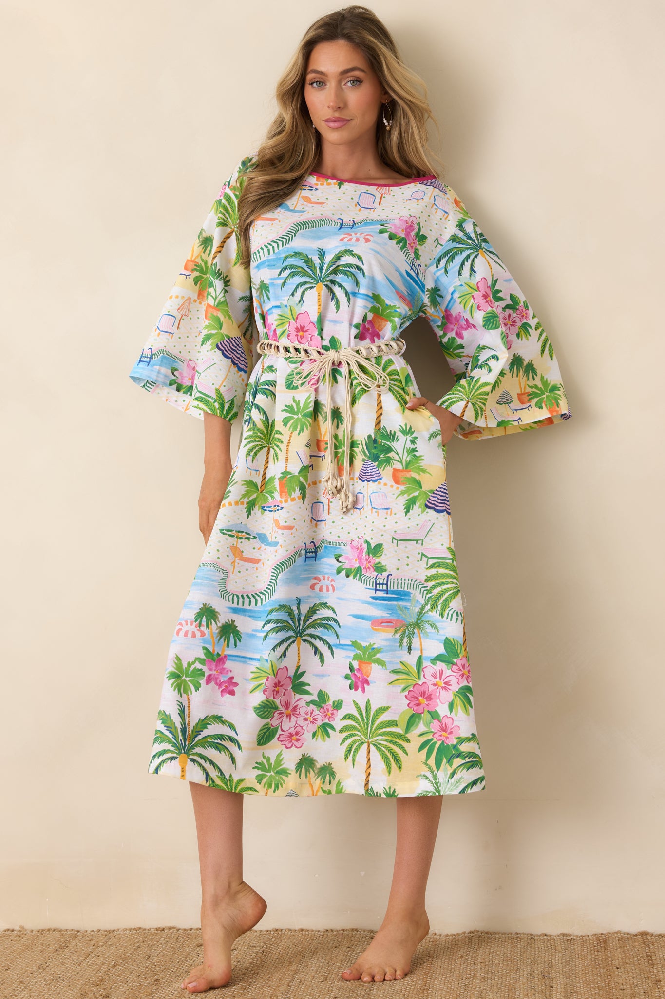 Lightweight caftan with adjustable waist and playful poolside-inspired pattern.