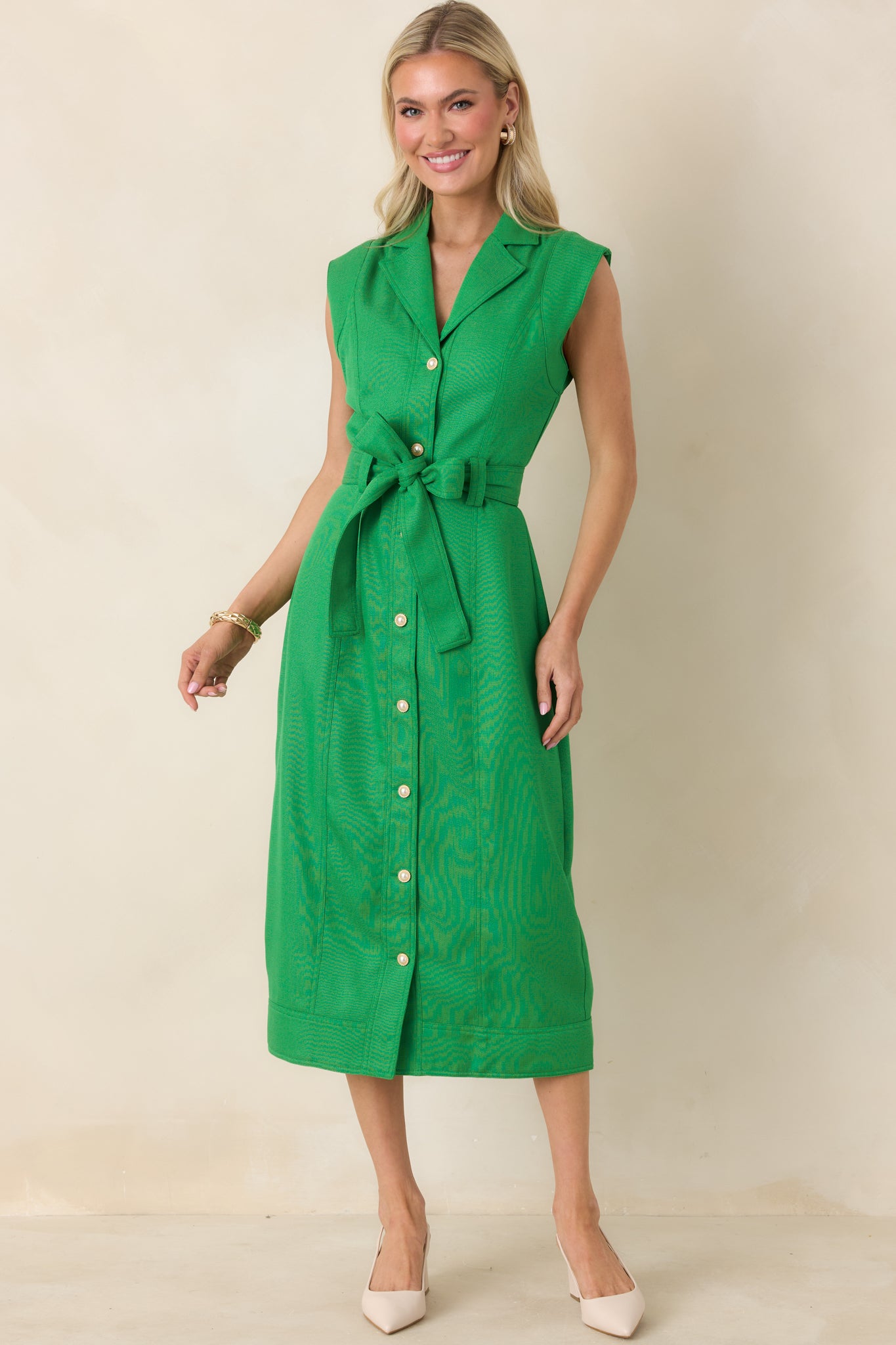 Green midi dress styled front-facing, showing clean drape and polished woven fabric finish.