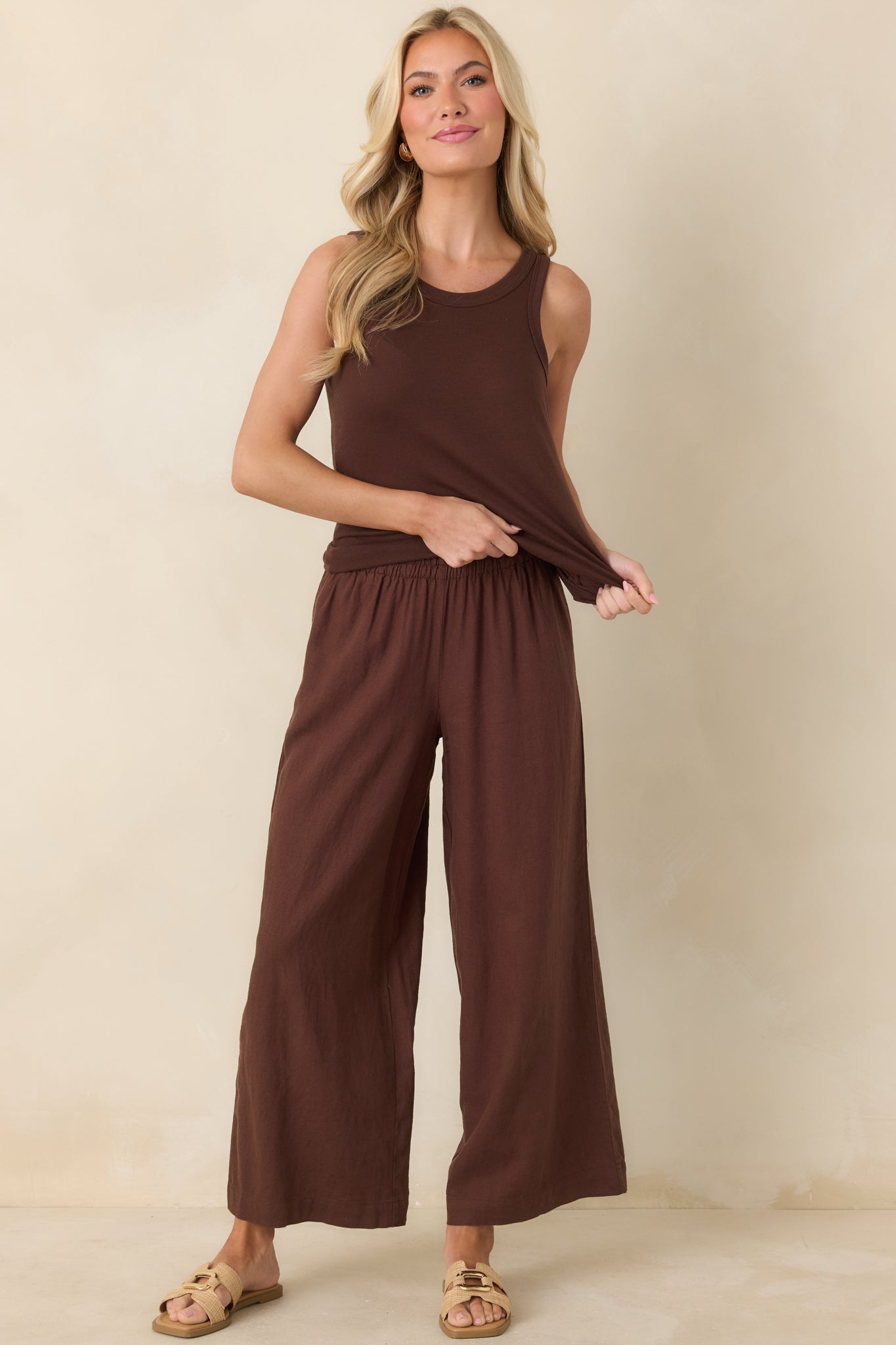 Brown tank top with a relaxed fit, round neckline, and breathable lightweight fabric.