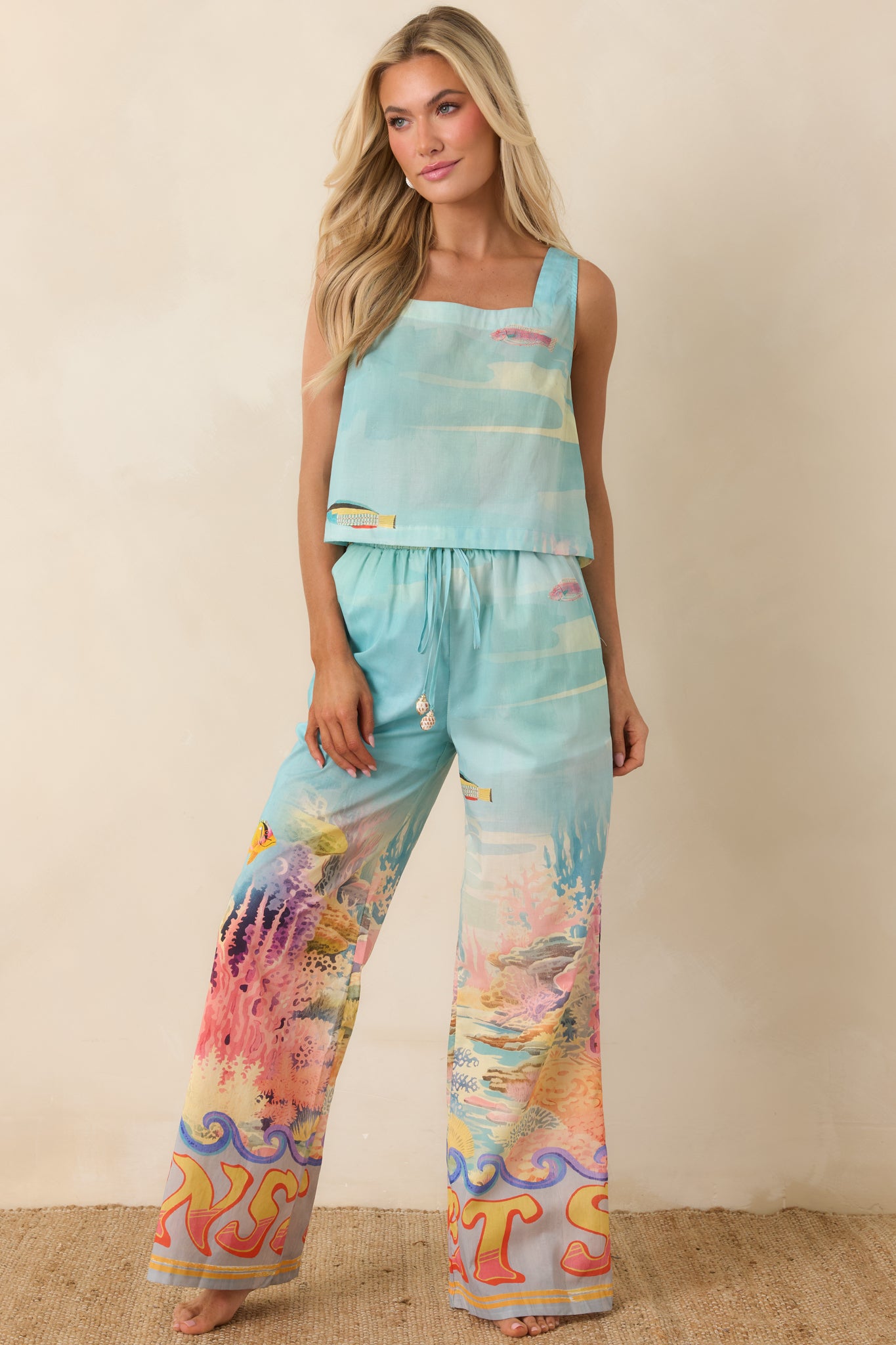 Comfortable wide-leg pants with playful resort-ready tropical pattern and soft drape.