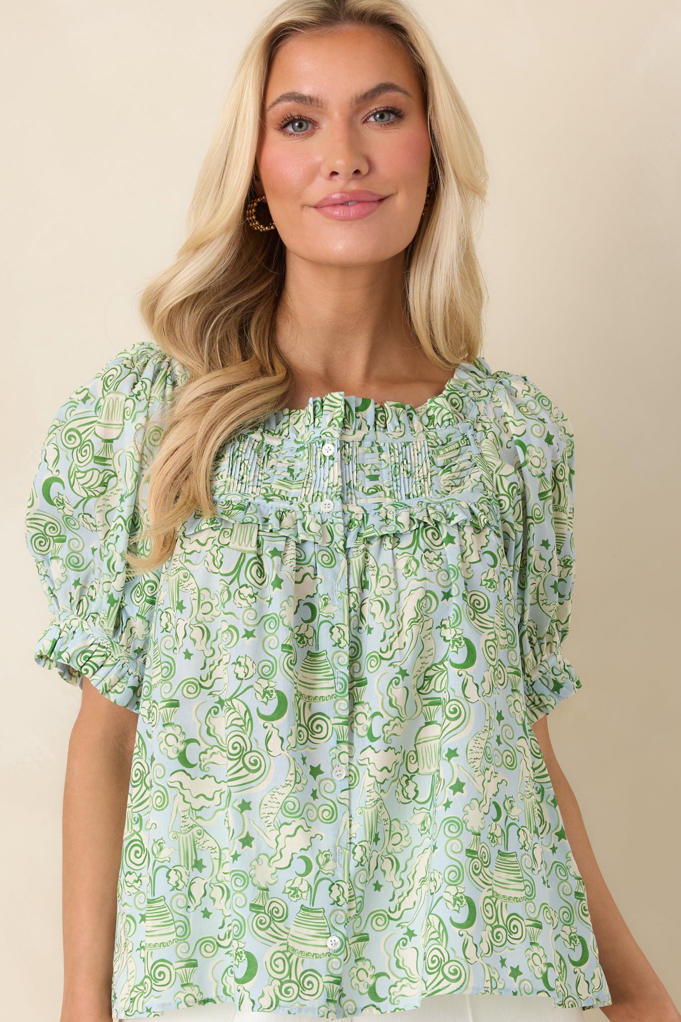Short puff sleeve with elastic ruffle cuff in blue and green cotton.