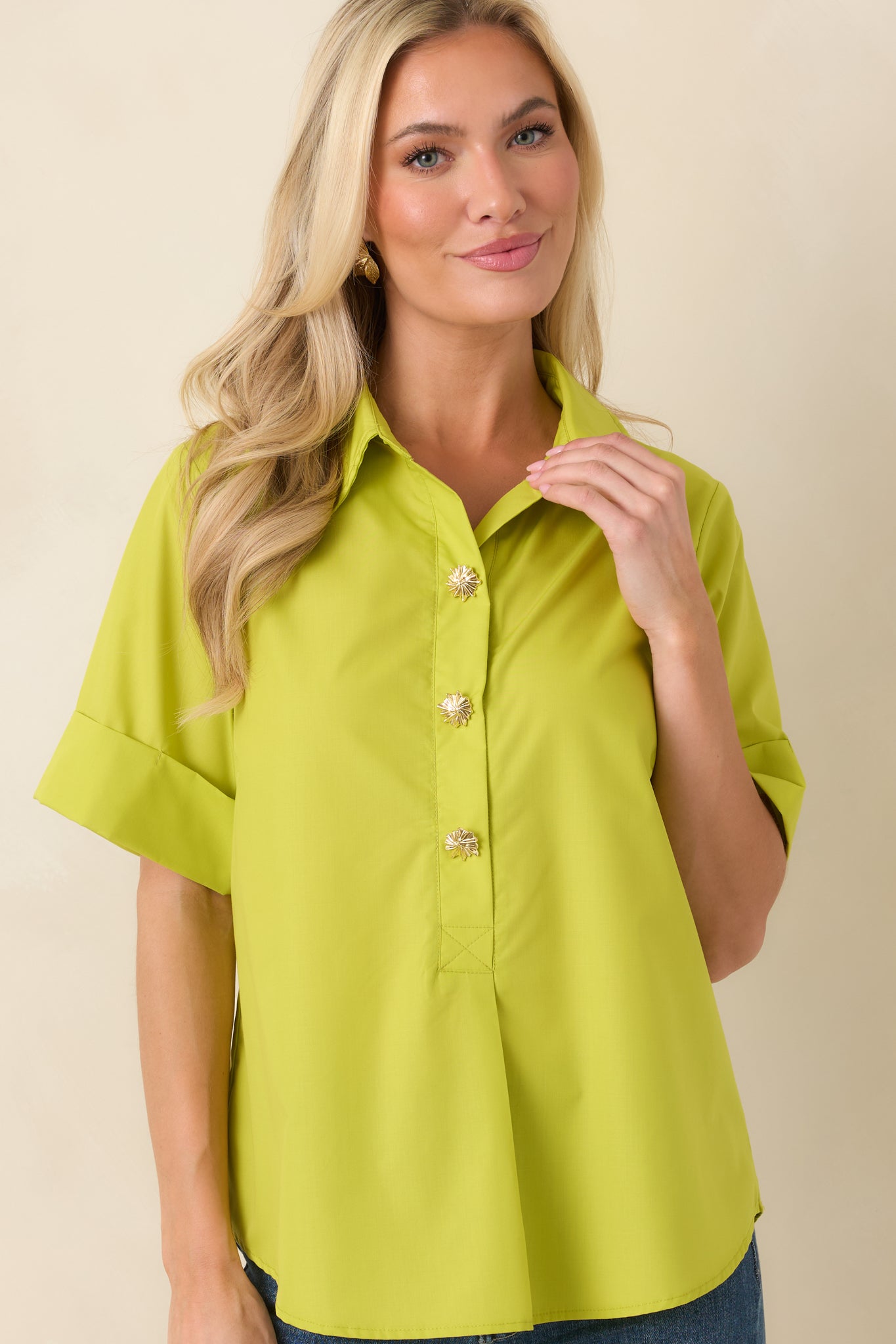 Detail view showcasing lightweight fabric, clean tailoring, and subtle pleat shaping near the hemline.