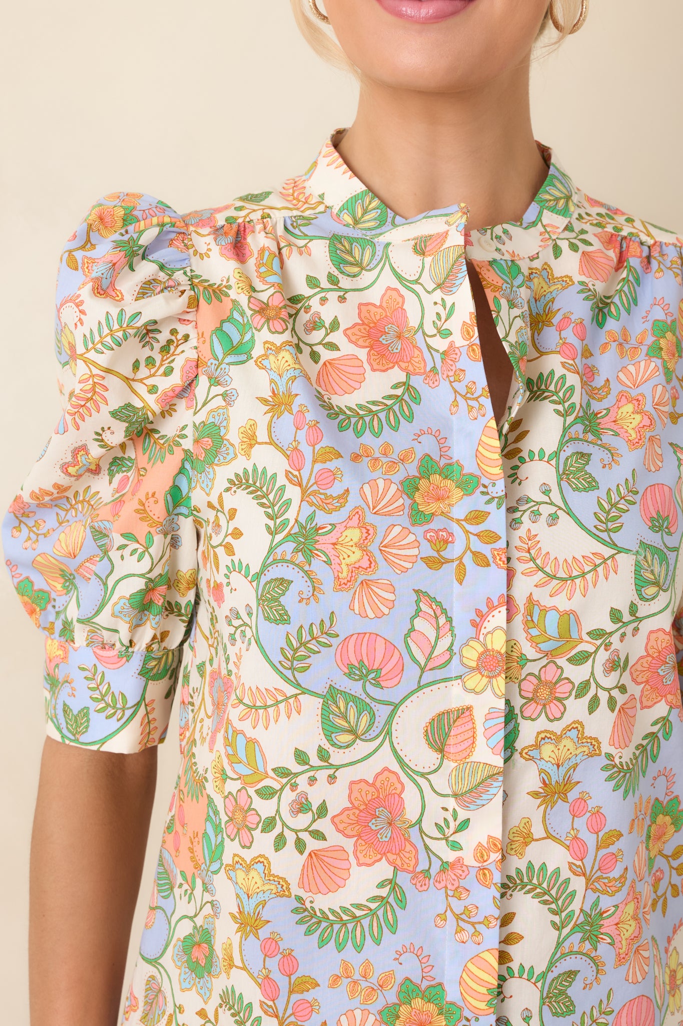 Close-up of the breathable cotton fabric and structured cuff construction that maintains the blouse’s shape while keeping it lightweight.