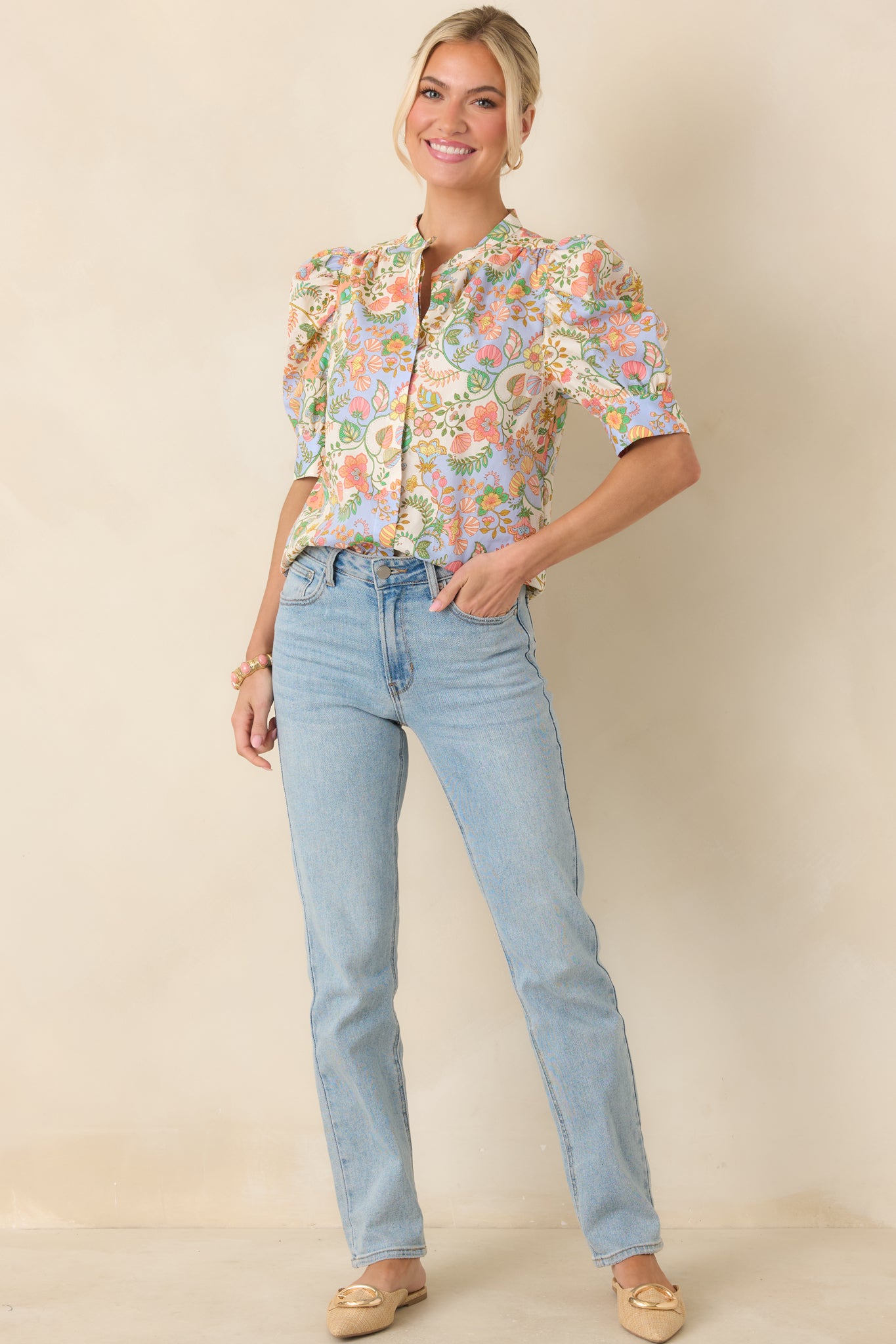 Breathable cotton blouse designed with bold puff short sleeves and defined cuffs that create soft structure and subtle drama.