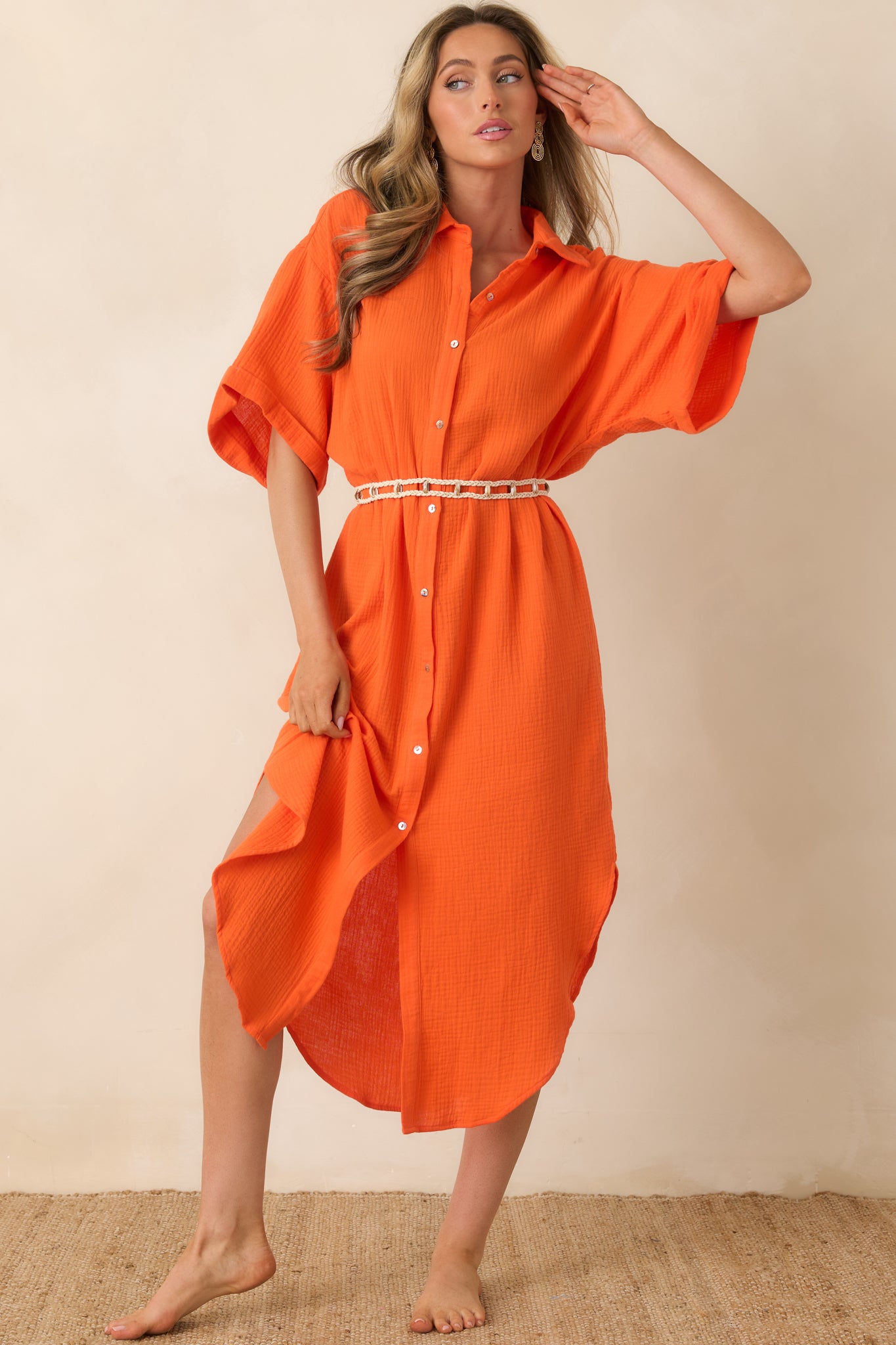 Cotton midi dress with elbow-length sleeves, collared top, and laid-back silhouette.