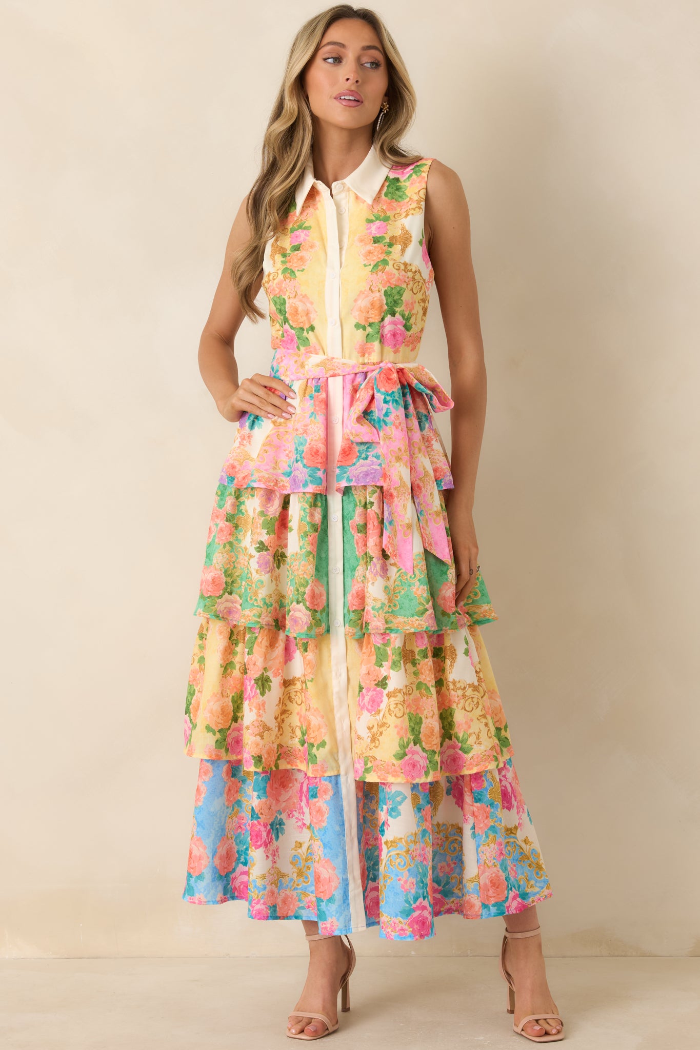 Floral midi dress with coordinating tie belt, relaxed fit, and tiered skirt movement.