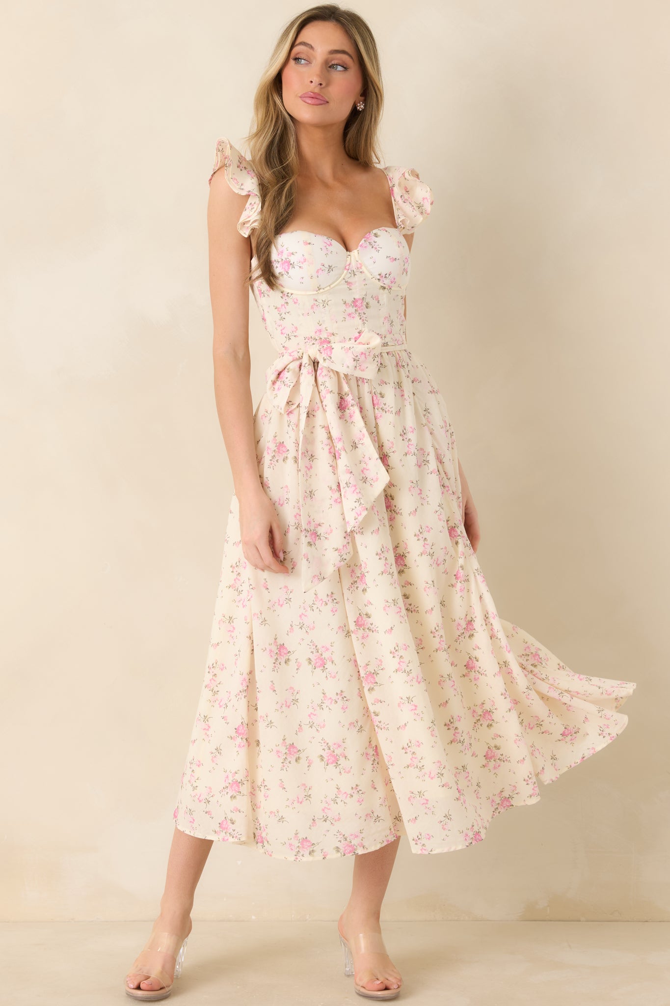 Front view of a light rose pink floral maxi dress with sweetheart neckline, padded bust, and flowing skirt.