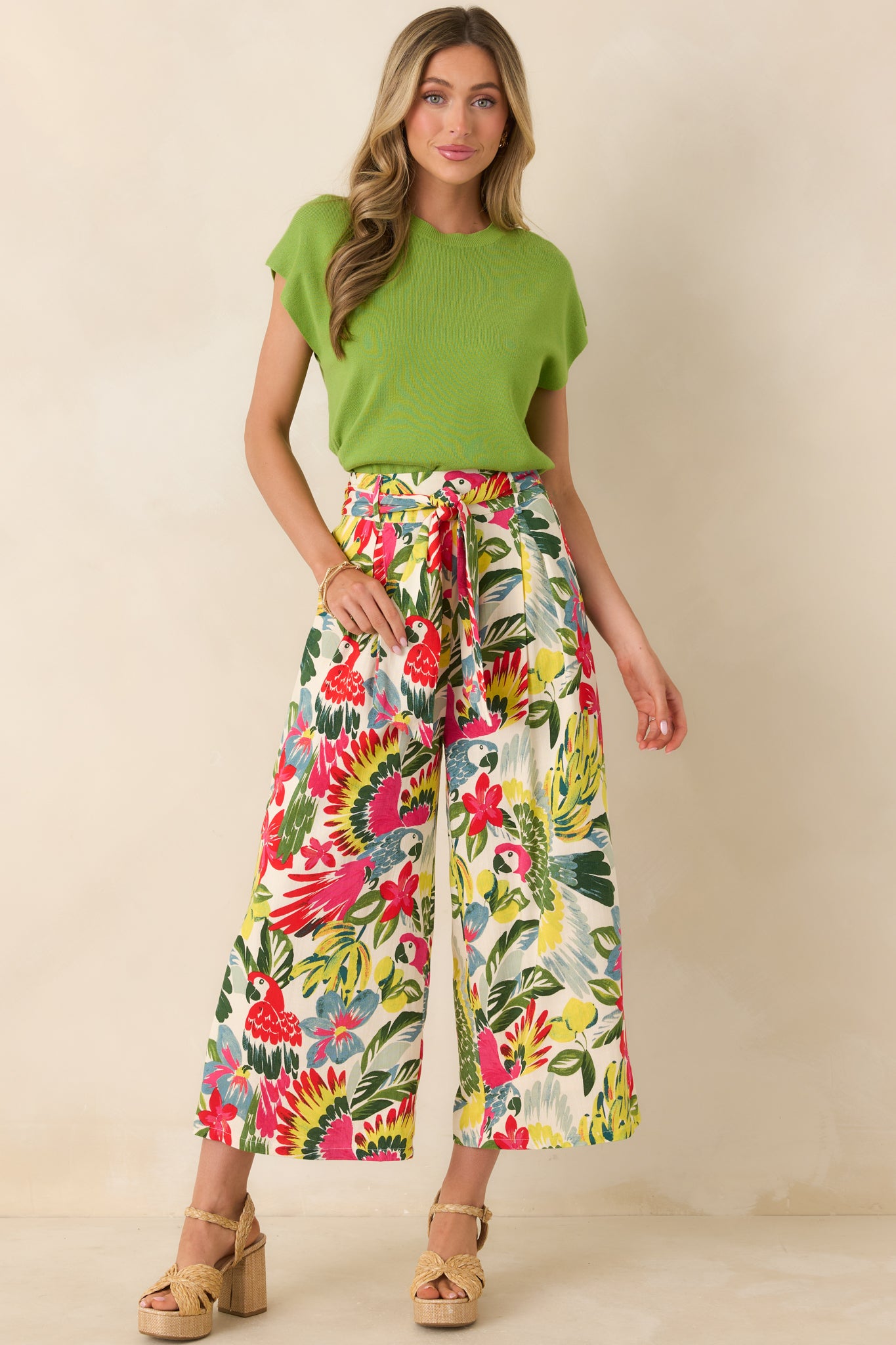 Front view of knit crewneck sweater with short relaxed sleeves and straight silhouette.