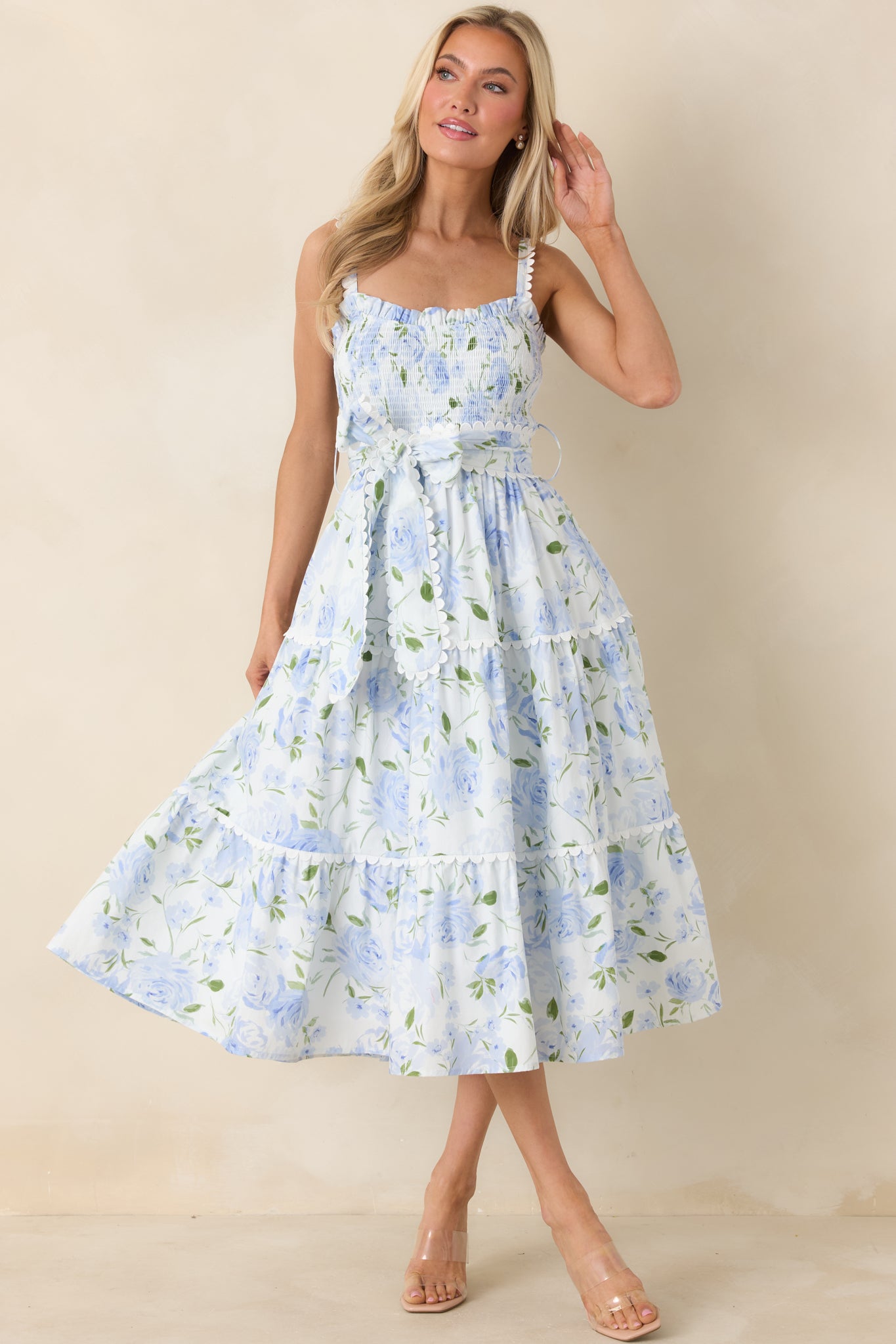 Blue maxi dress styled front-facing, emphasizing flexible smocked bodice and relaxed skirt movement.