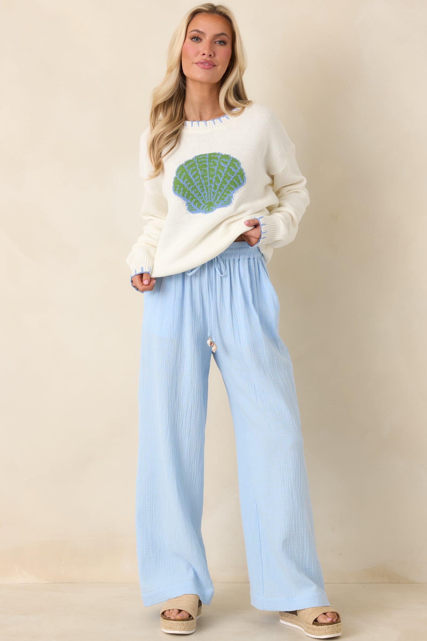 Blue wide-leg pants designed with breathable cotton fabric, soft structure, and flowing movement.