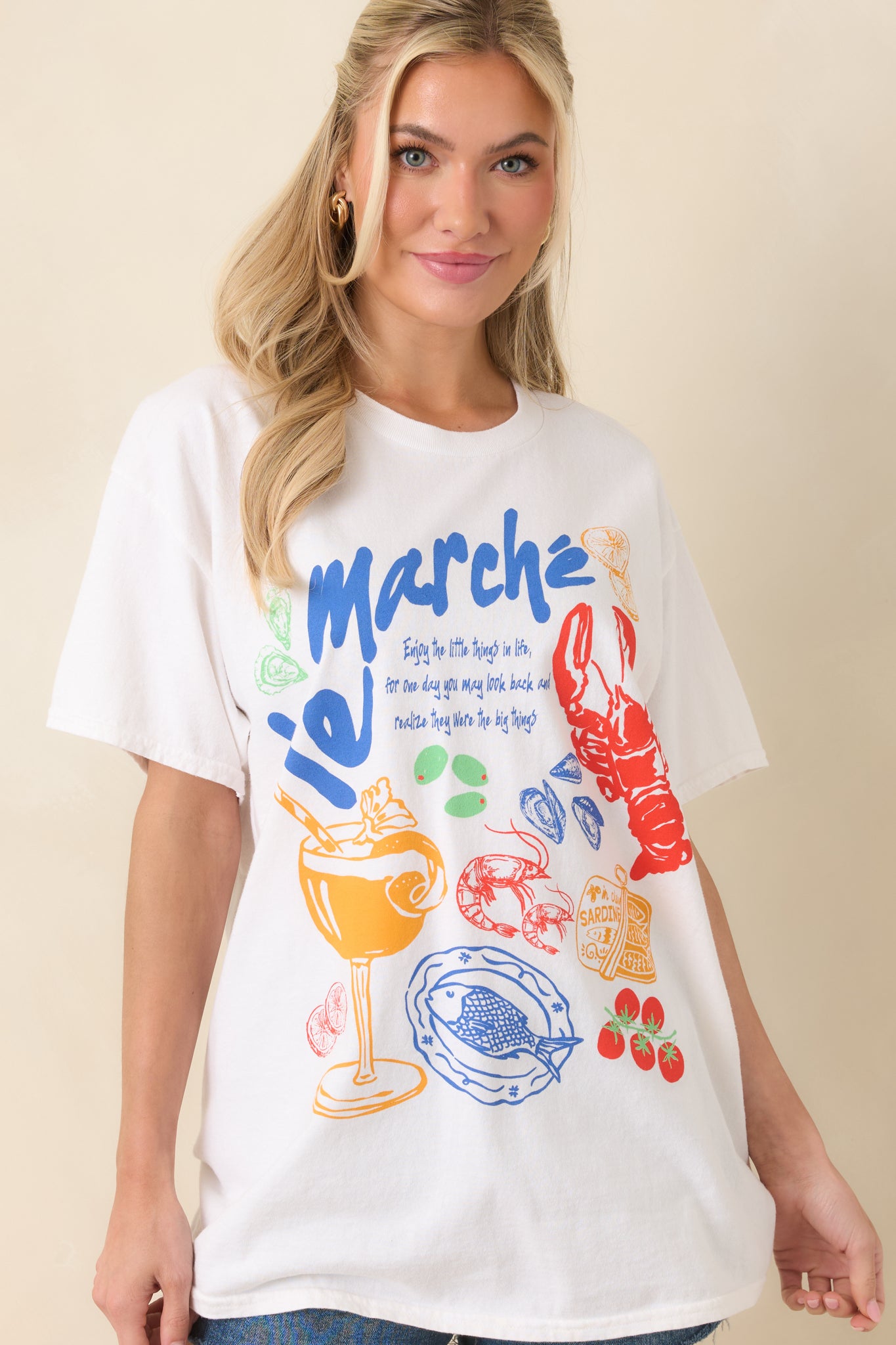 Close view of the vibrant front graphic showing intricate color details on the white fabric.