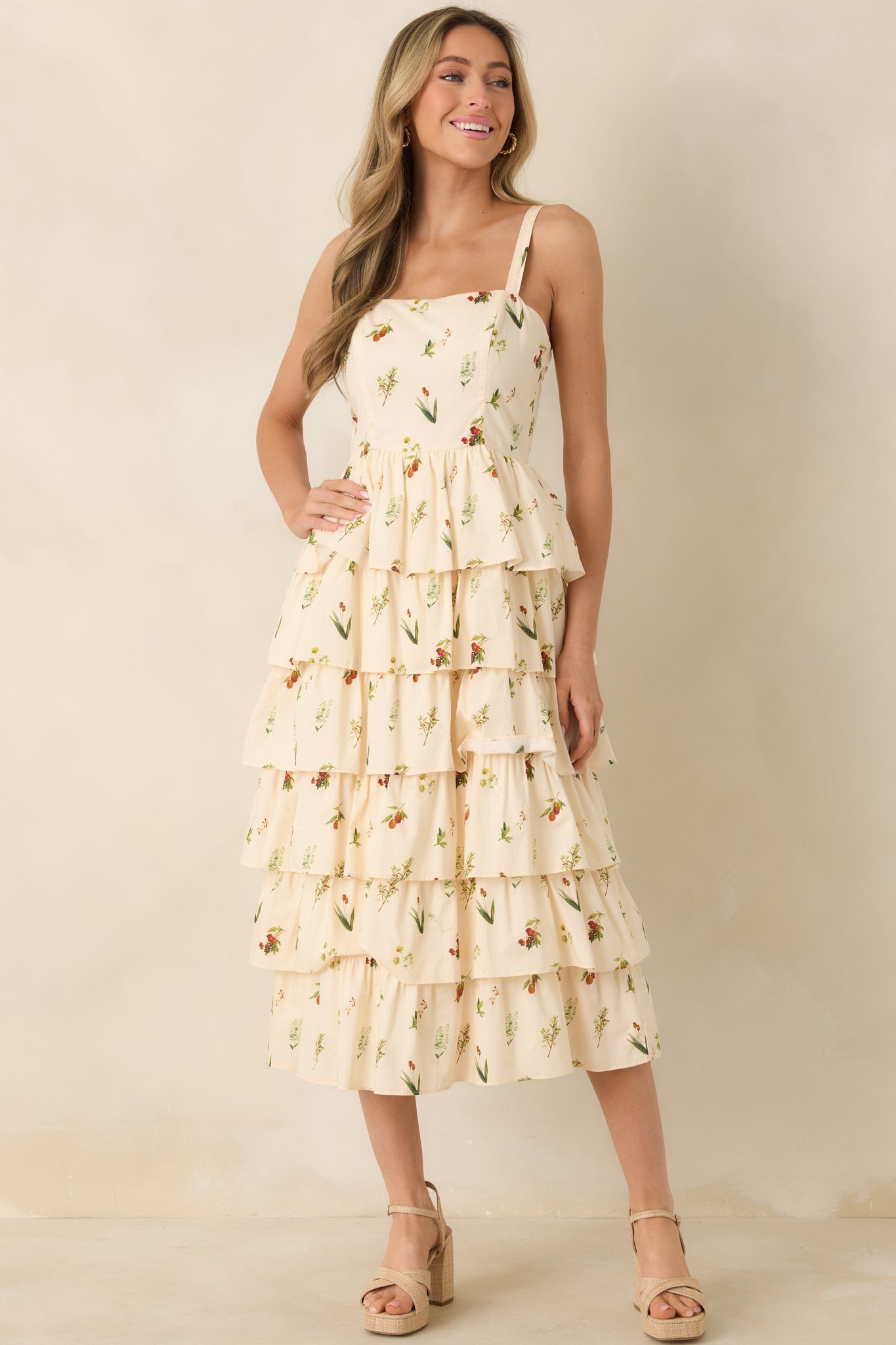 Ivory midi dress with multicolor floral print, square neckline, and tiered skirt.