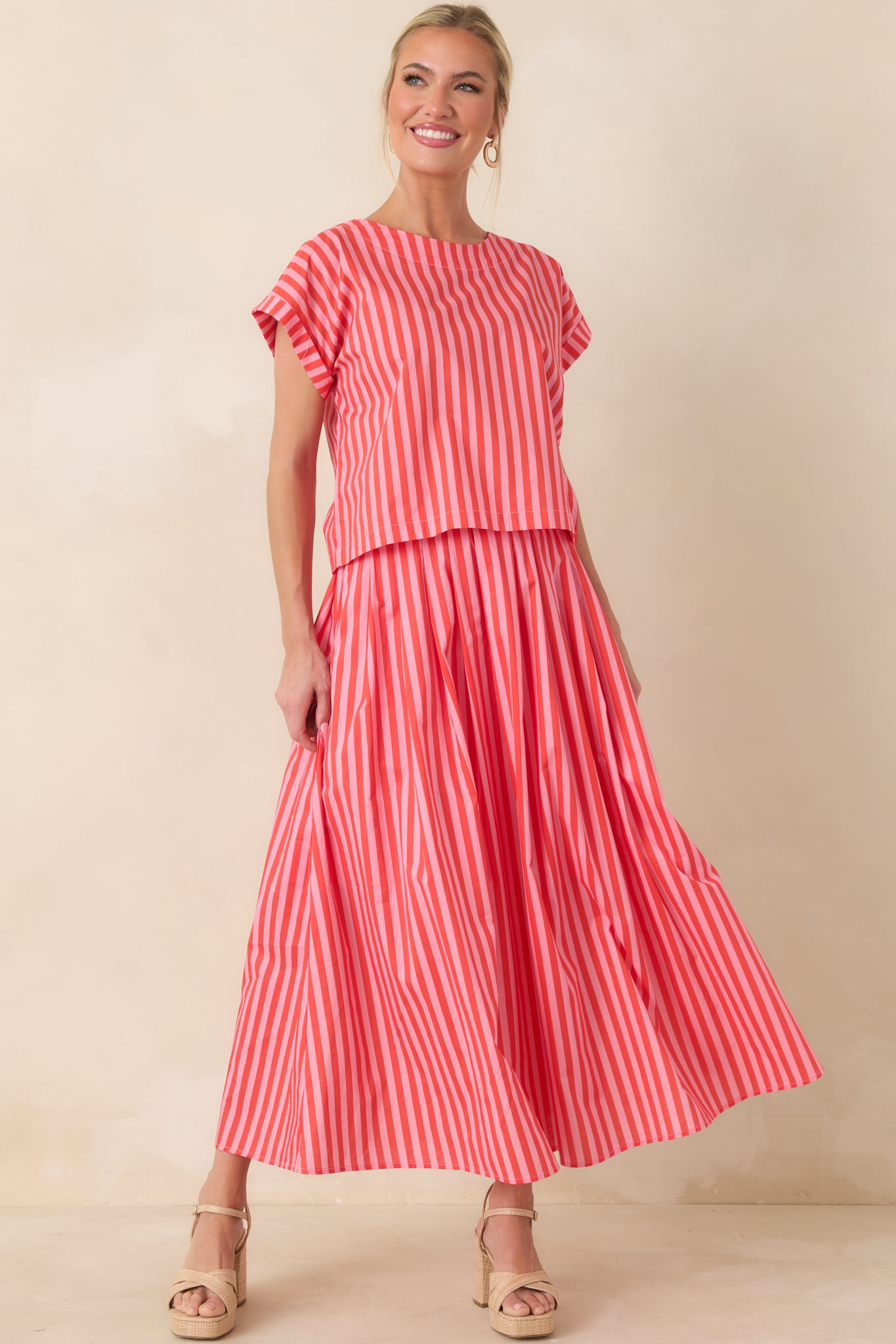 Cotton maxi skirt with a sweeping full-length silhouette, breathable woven texture, and elastic rear waistband for comfortable structure.