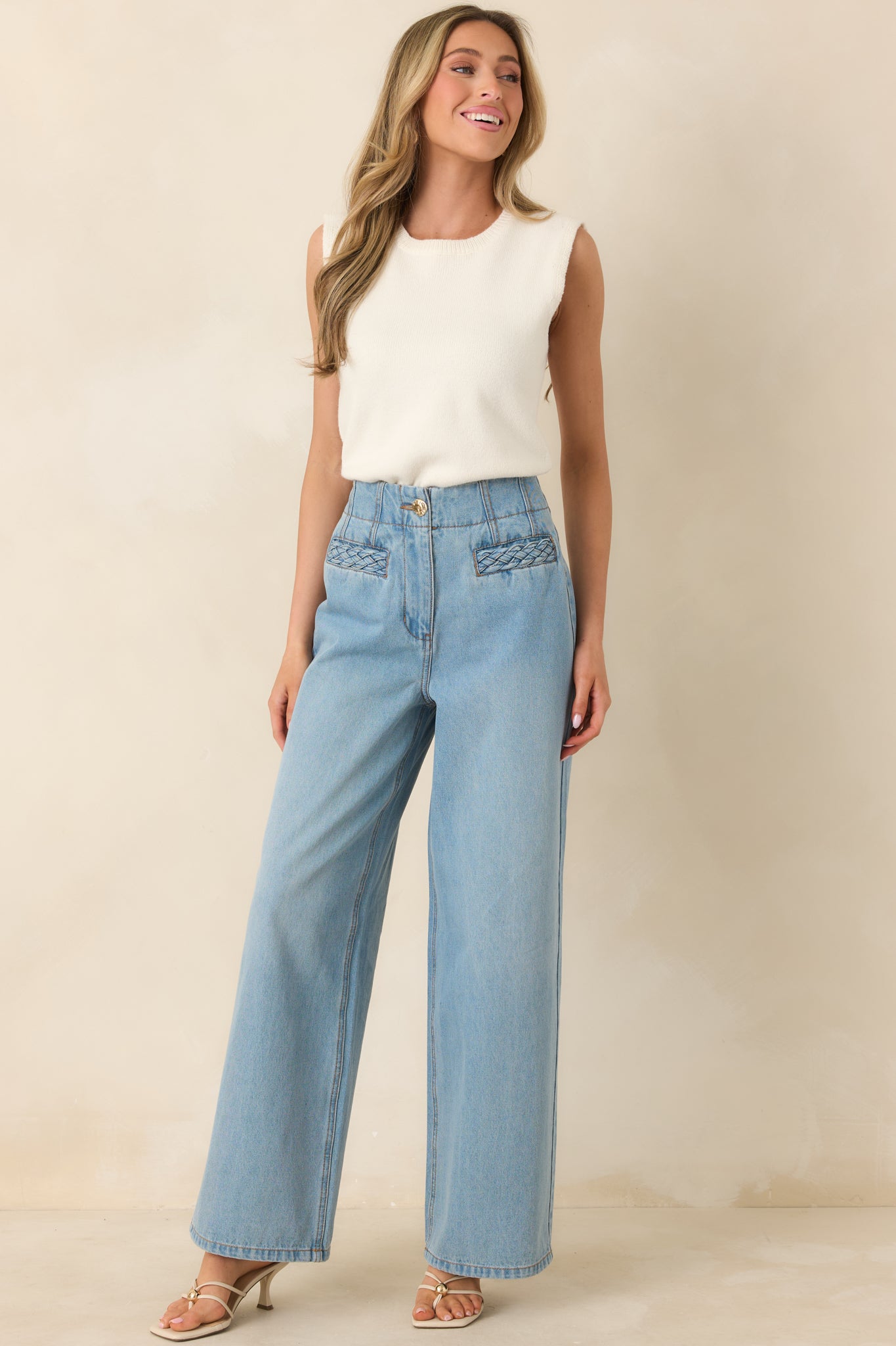 Light wash high-rise jeans with a relaxed straight-leg silhouette and classic five-pocket styling for a versatile, casual look.