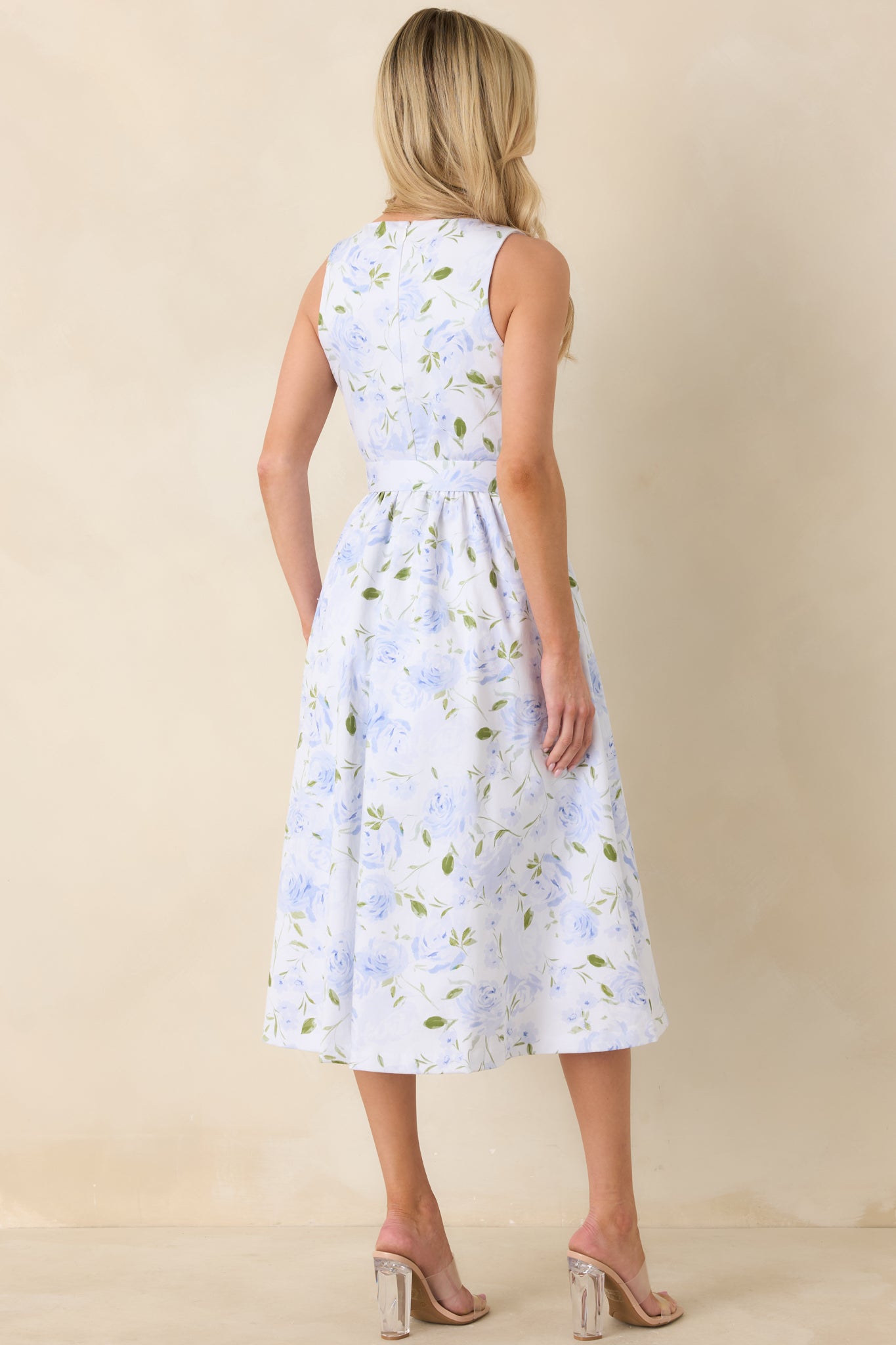 Back view of the light blue midi dress highlighting the concealed back zipper and smooth back panel.