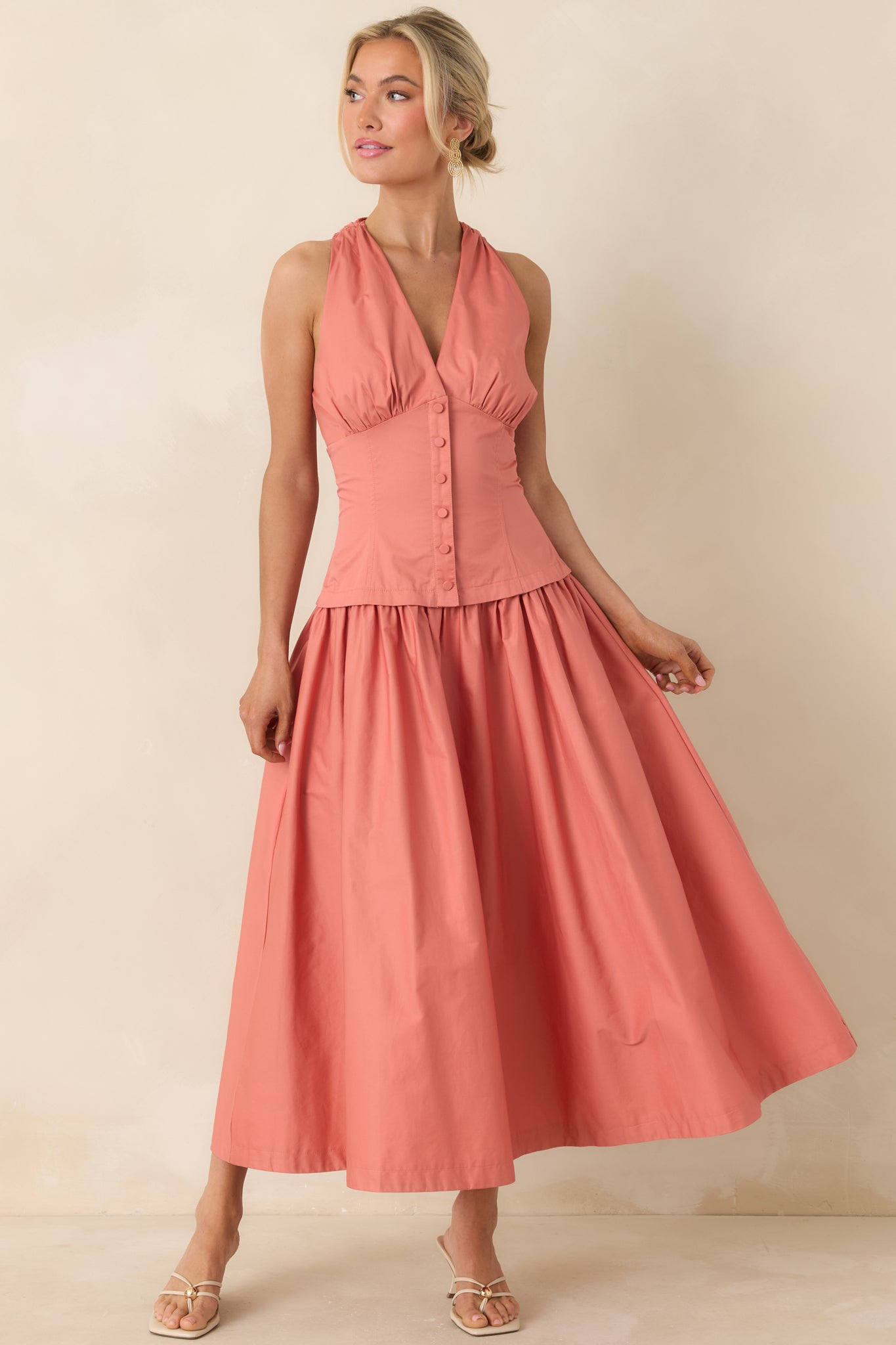 Cotton midi dress with fitted bodice and soft, flowing silhouette.