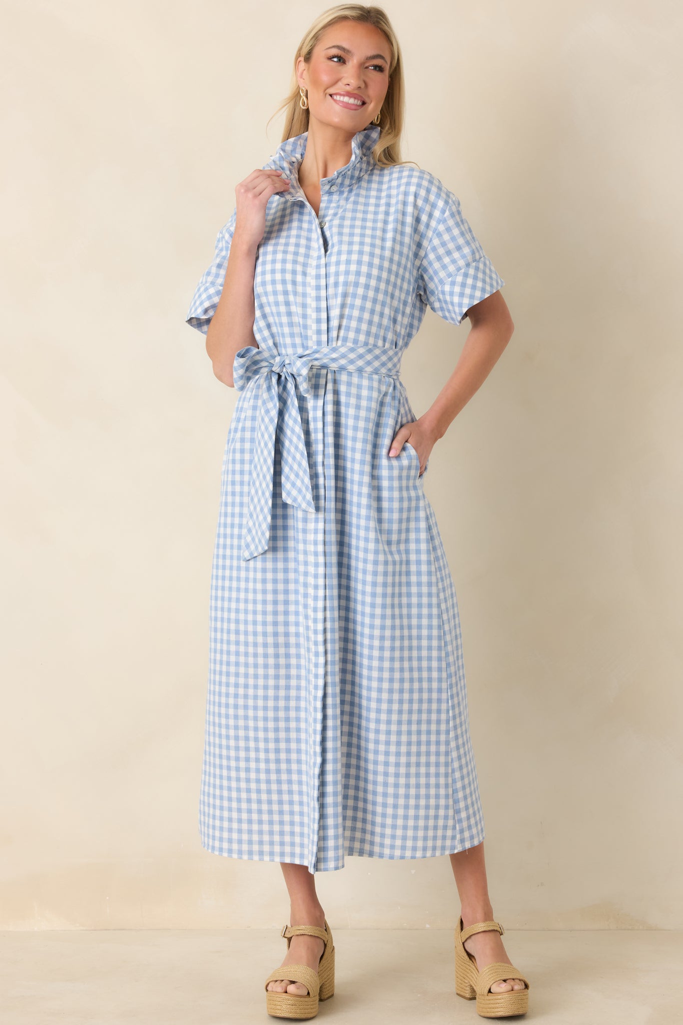 Full-body view displaying the gingham maxi dress styled with defined waist and flowing hemline.