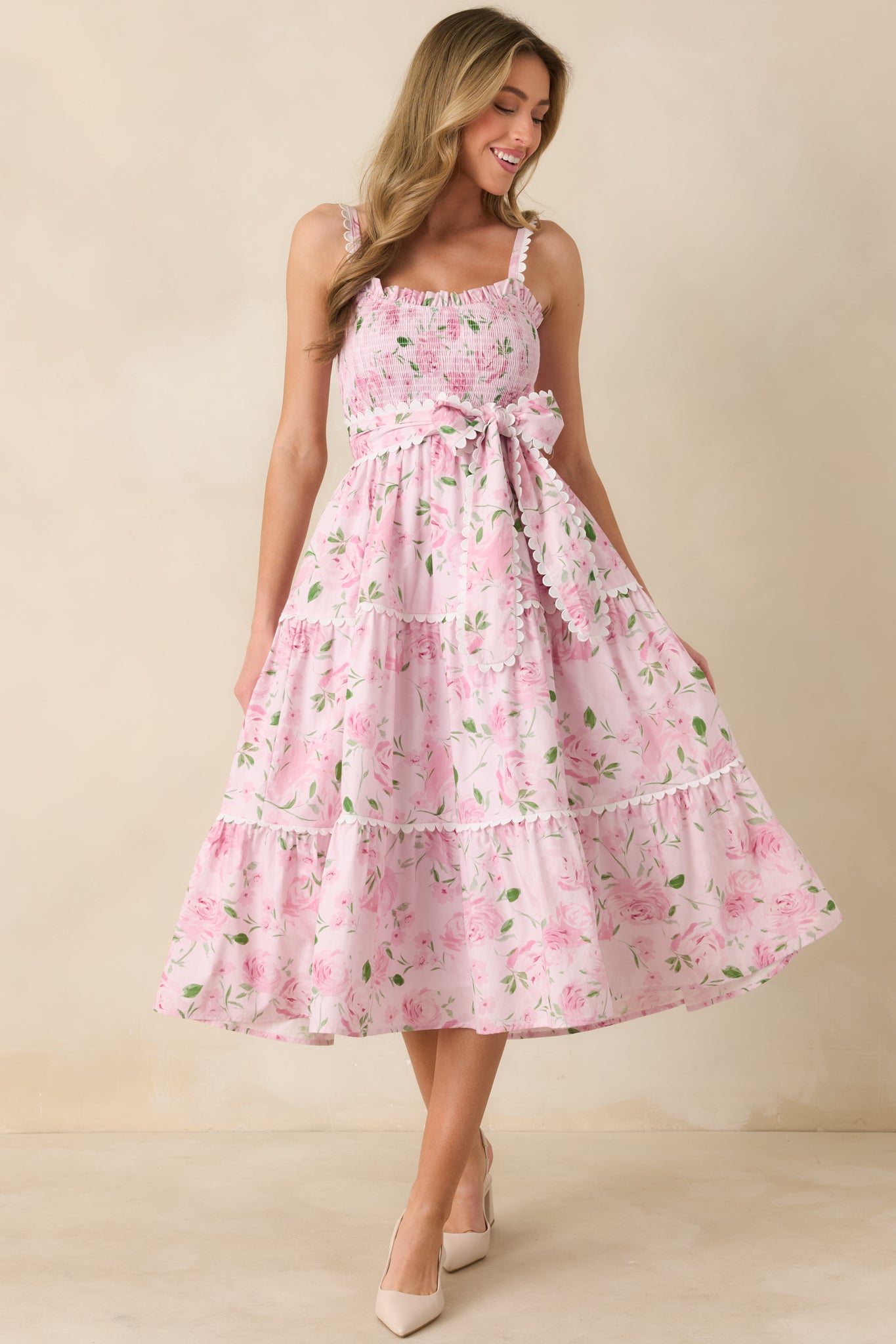 Full-length front view of the pink maxi dress showcasing the smocked bodice and square neckline.