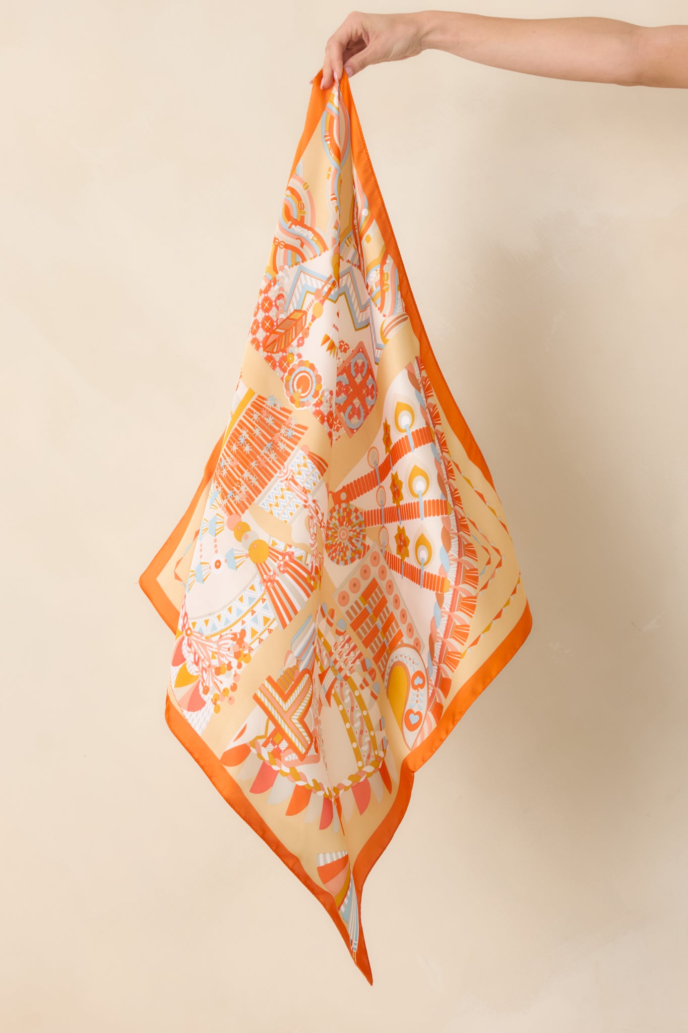 Smooth lightweight fabric showing vibrant orange geometric pattern and precise edges.