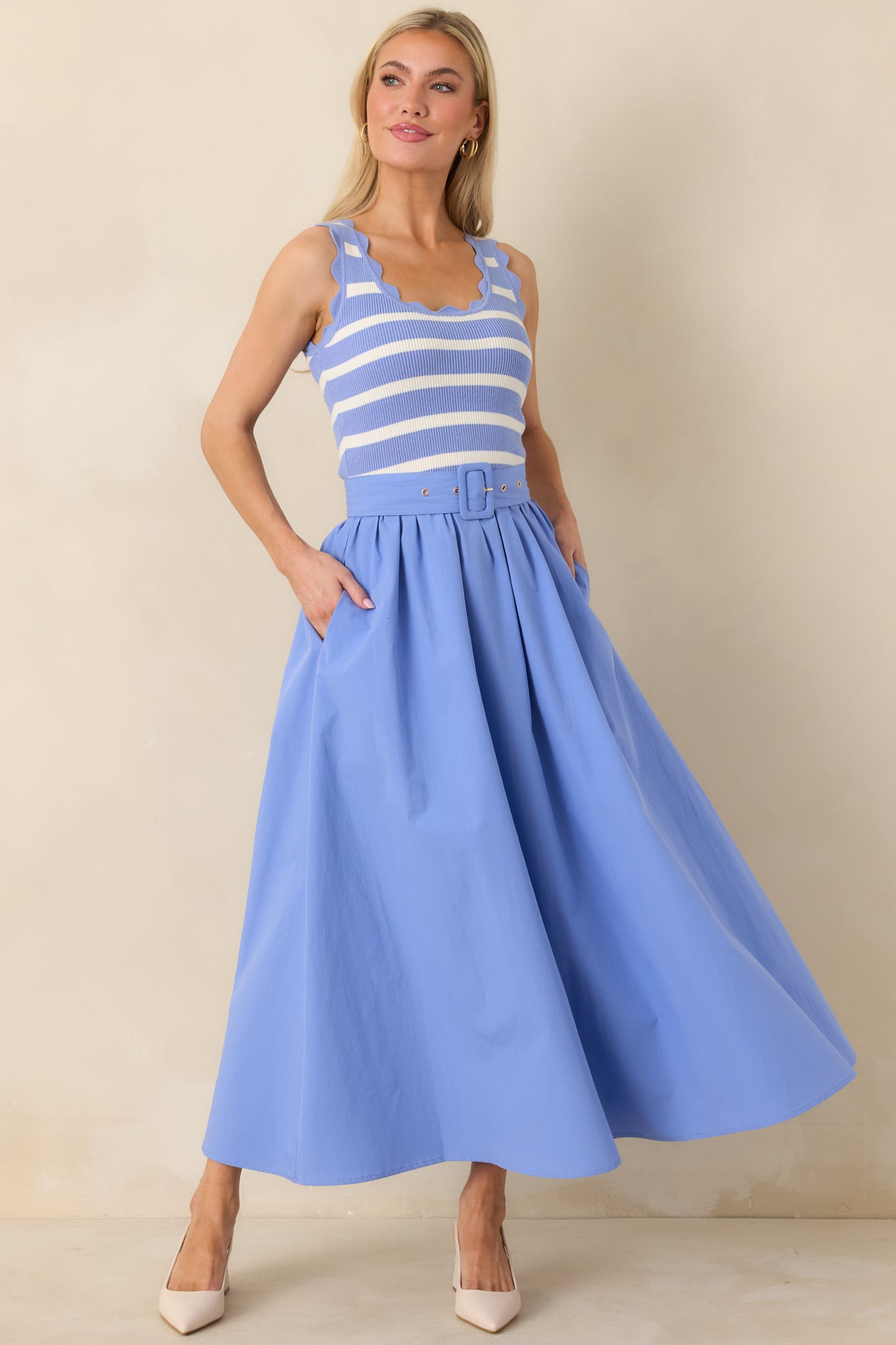 Angled front view highlighting the optional belt and relaxed A-line silhouette of the dress.