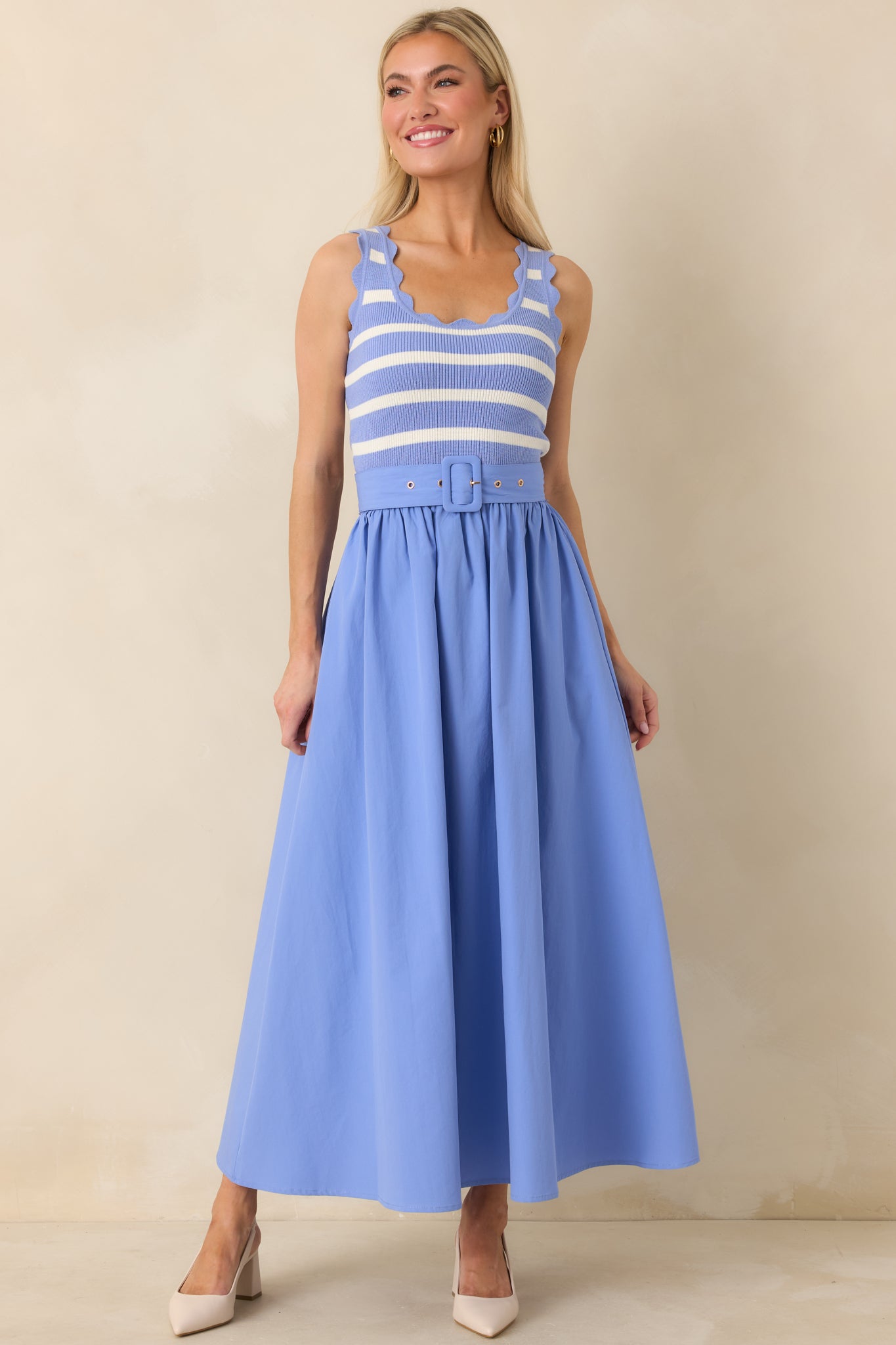 Front-facing full-length view of the blue midi dress showing the striped knit top with scalloped hems and solid skirt.