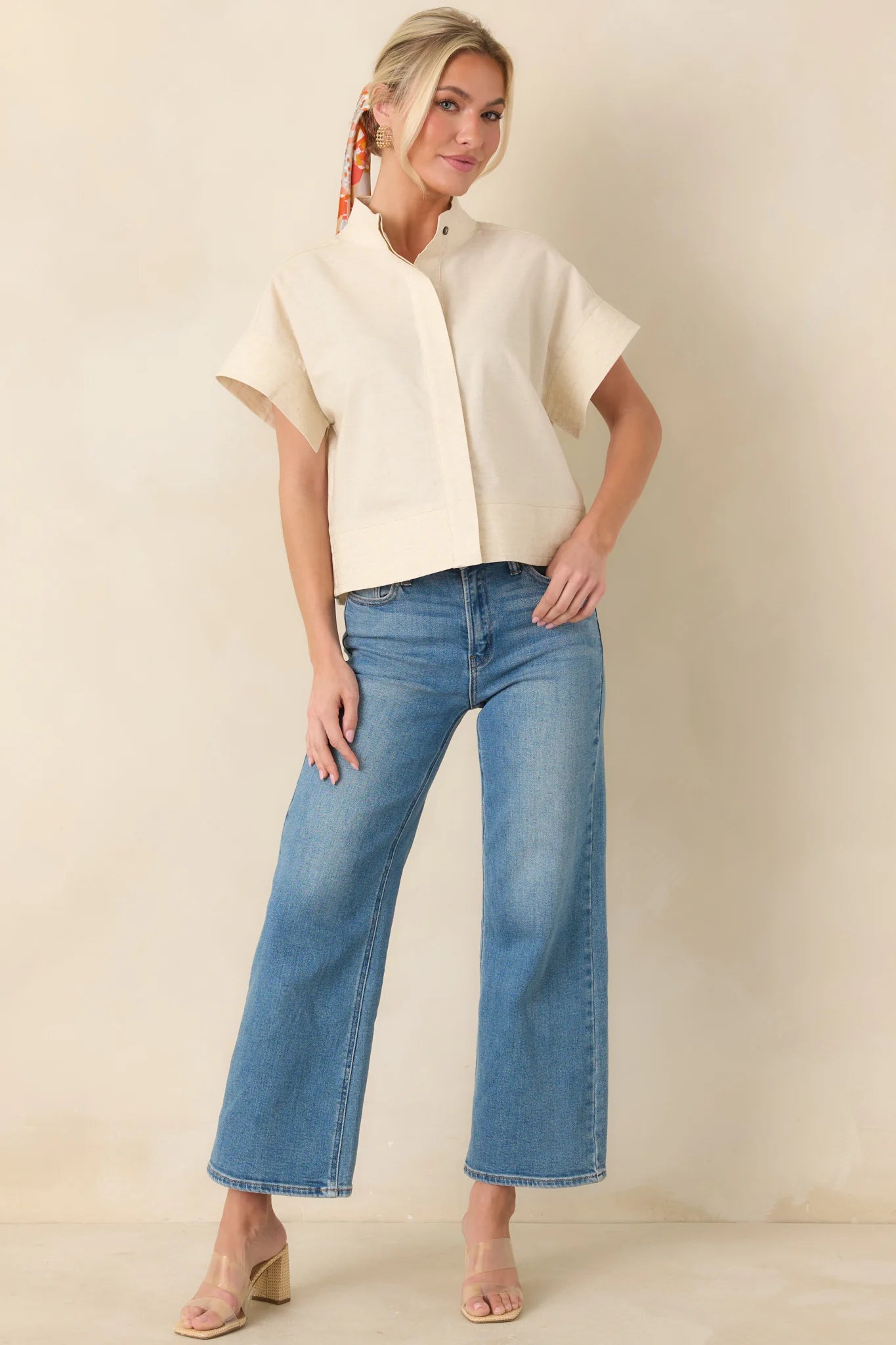 Light wash wide leg jeans with a high-rise waist and slightly cropped length.