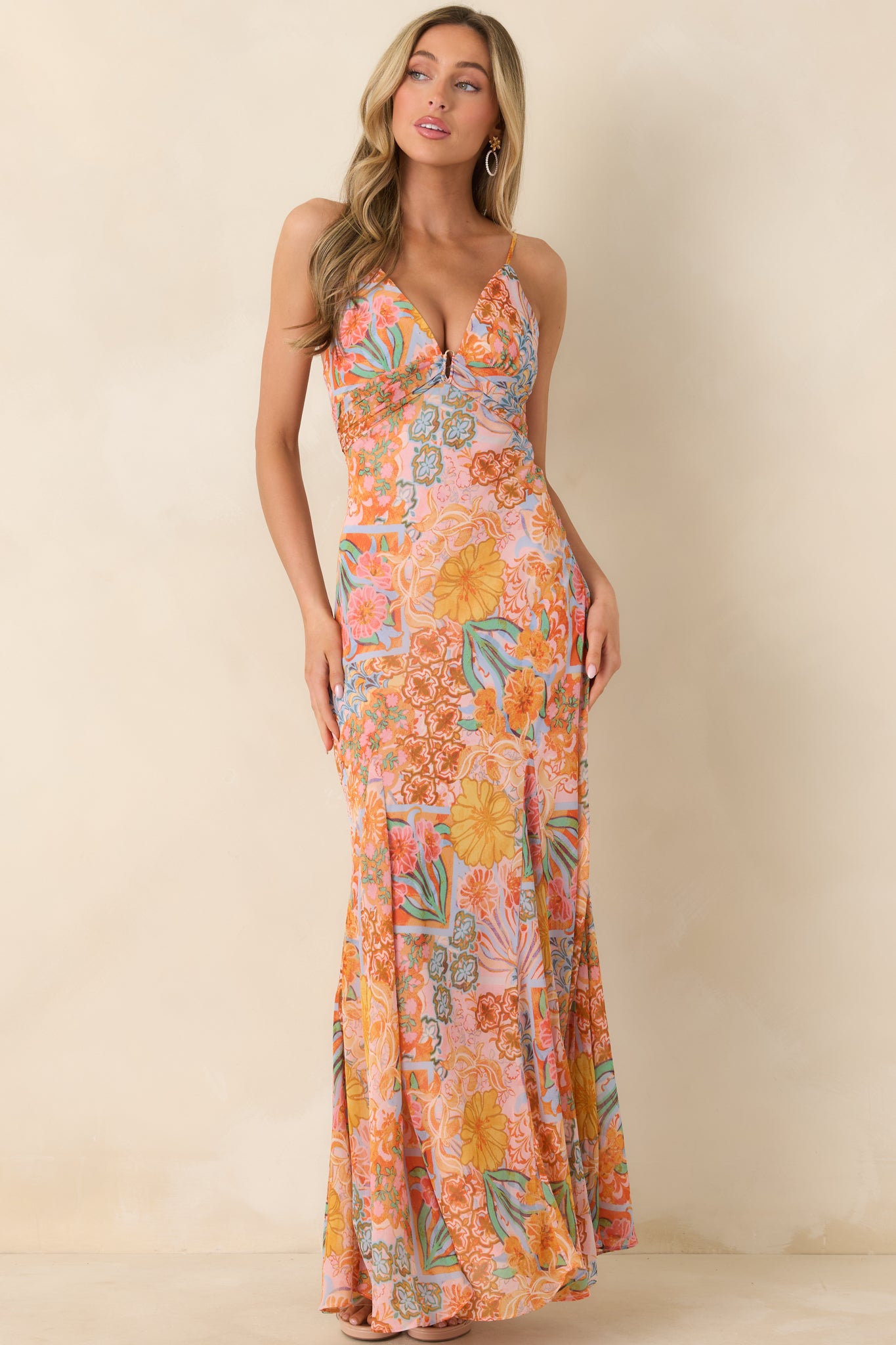 Pink floral maxi with plunging V-neckline, subtle ring detail, smocked back for flexible fit, and a gracefully flowing skirt.