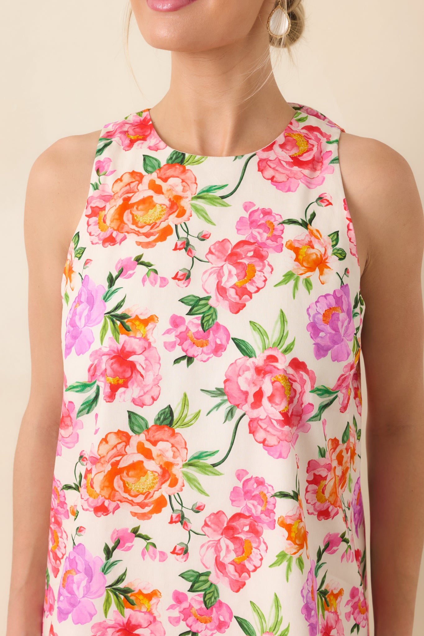 Detailed view of the pink multi floral cotton fabric highlighting the colorful botanical print.