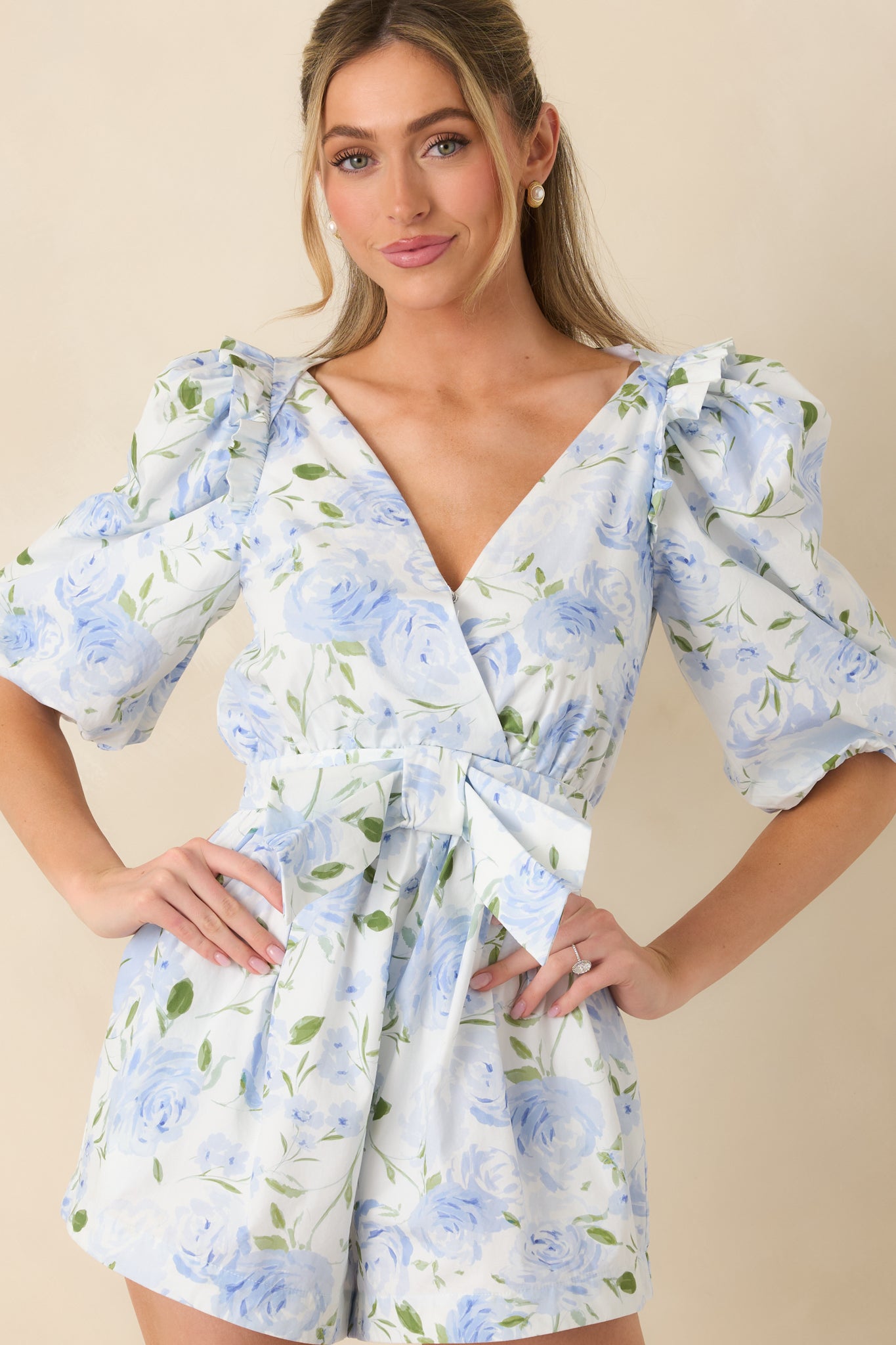 Cropped front view focusing on the V-neckline and wrap-style bodice construction.