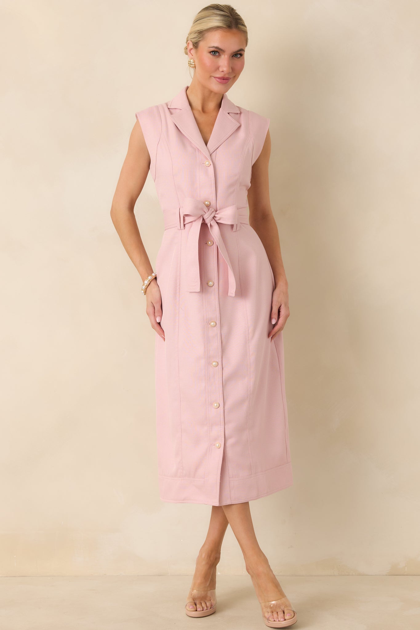 Full-length front view of the pink midi dress showcasing the structured lapel collar and button-front closure.
