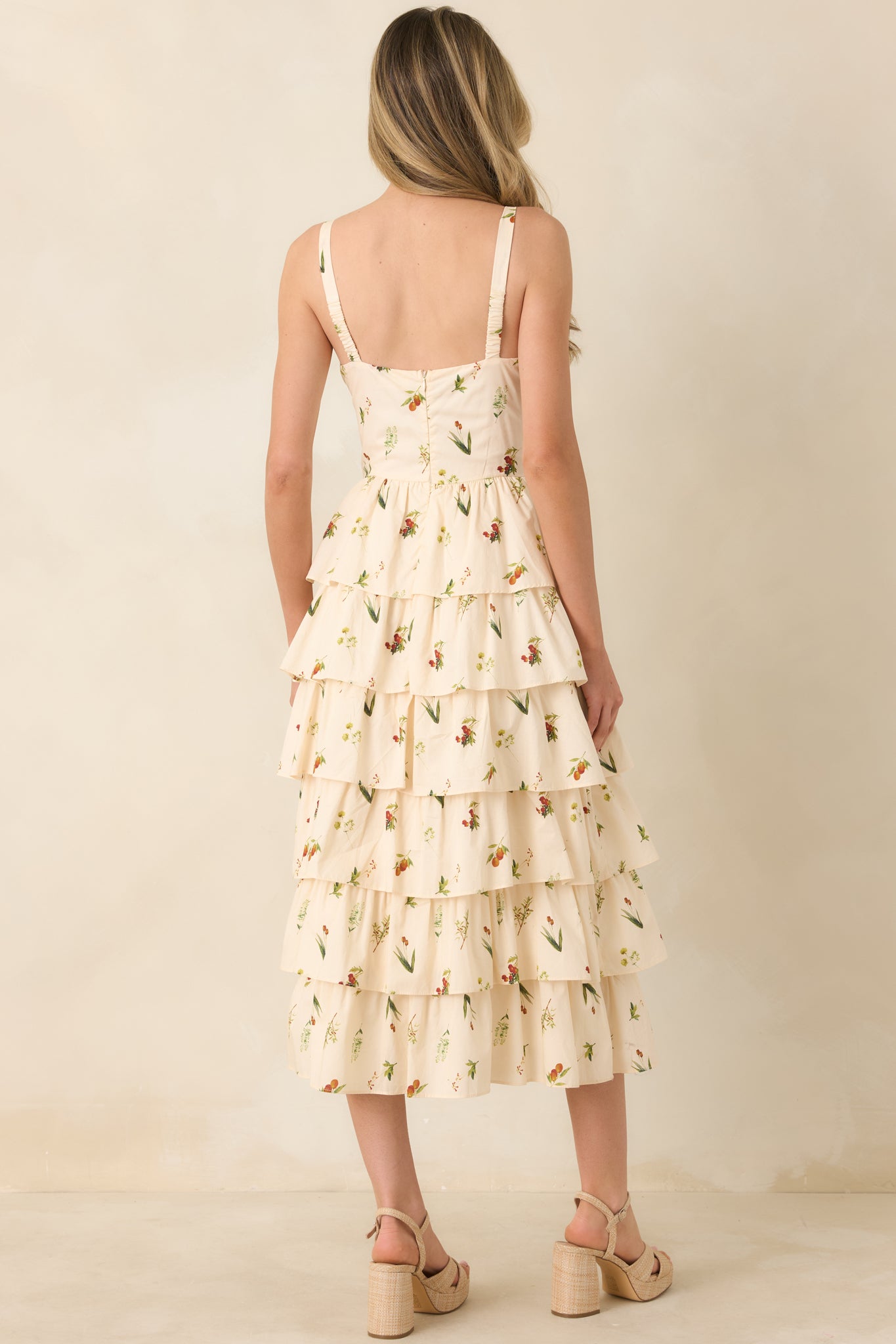 Back view of the ivory midi dress showing hidden back zipper closure and smooth tiered skirt.