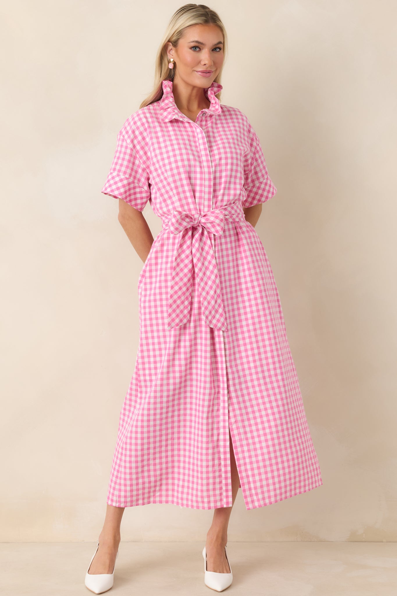 Gingham maxi dress highlighting the ruffle collar, button-front closure, and relaxed fit through the bodice.