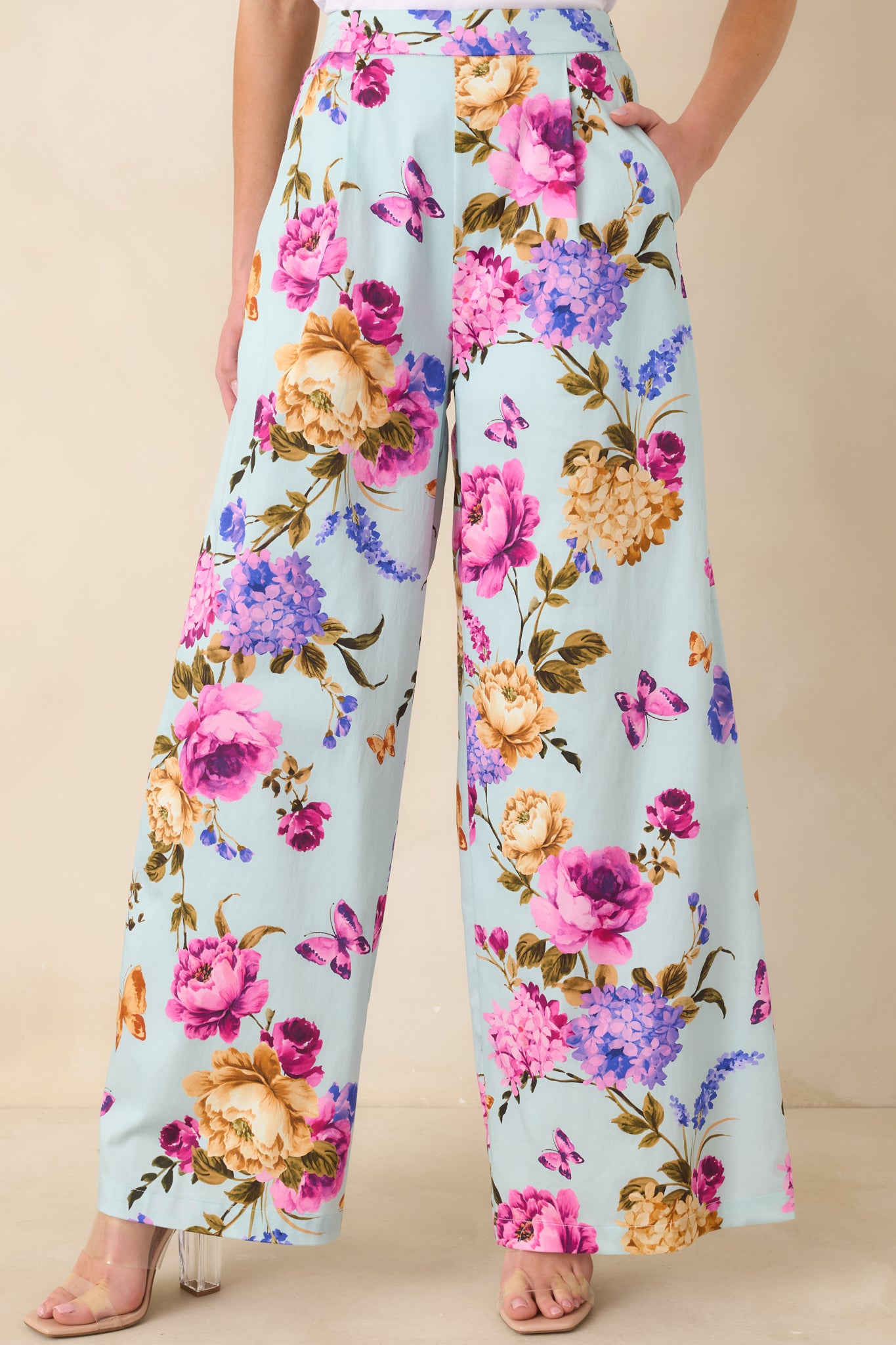 Cropped front view focusing on the waistband detail and multicolor pattern of the pants.