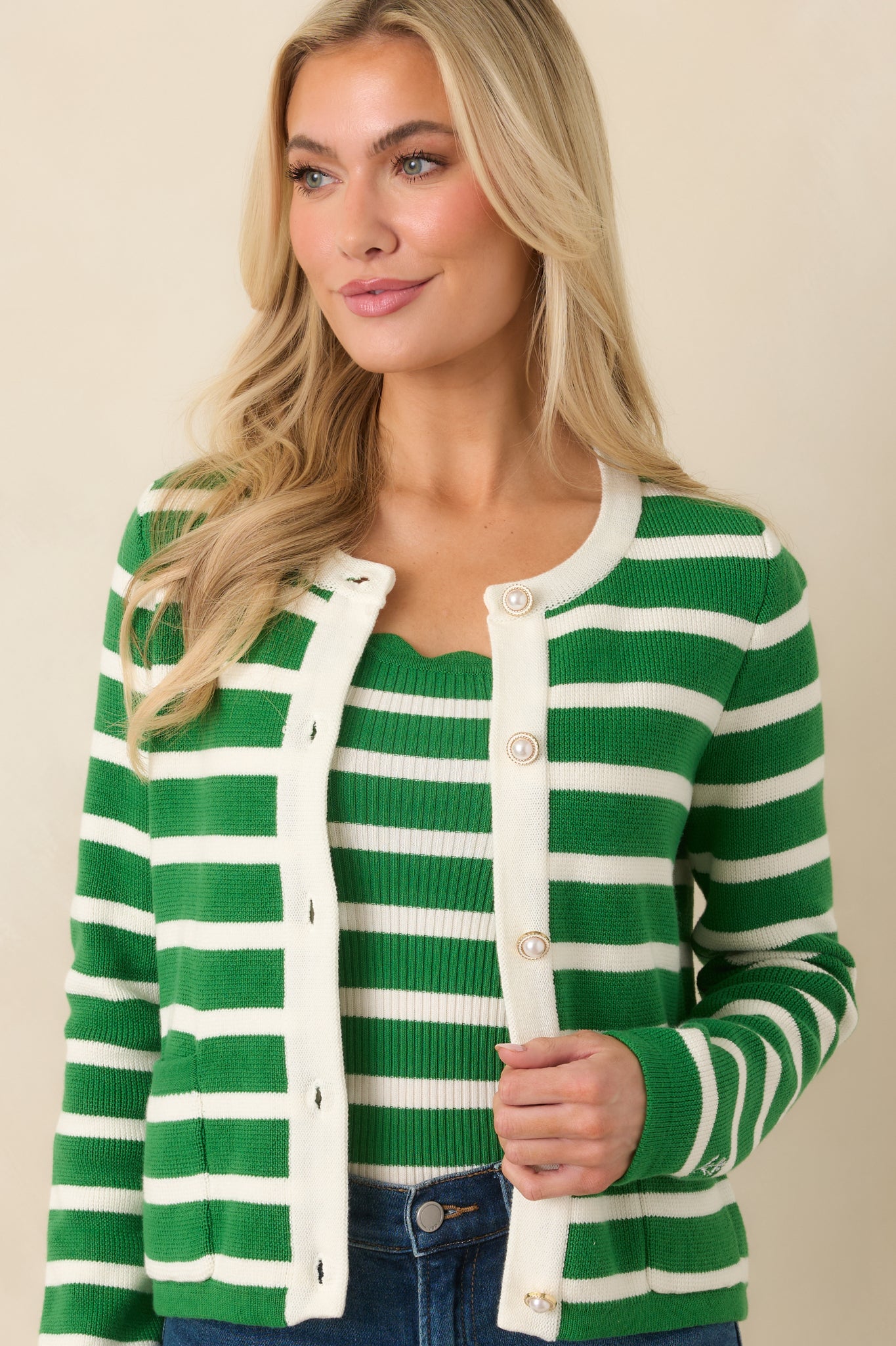 Cropped front view emphasizing the functional patch pockets and clean button closure.