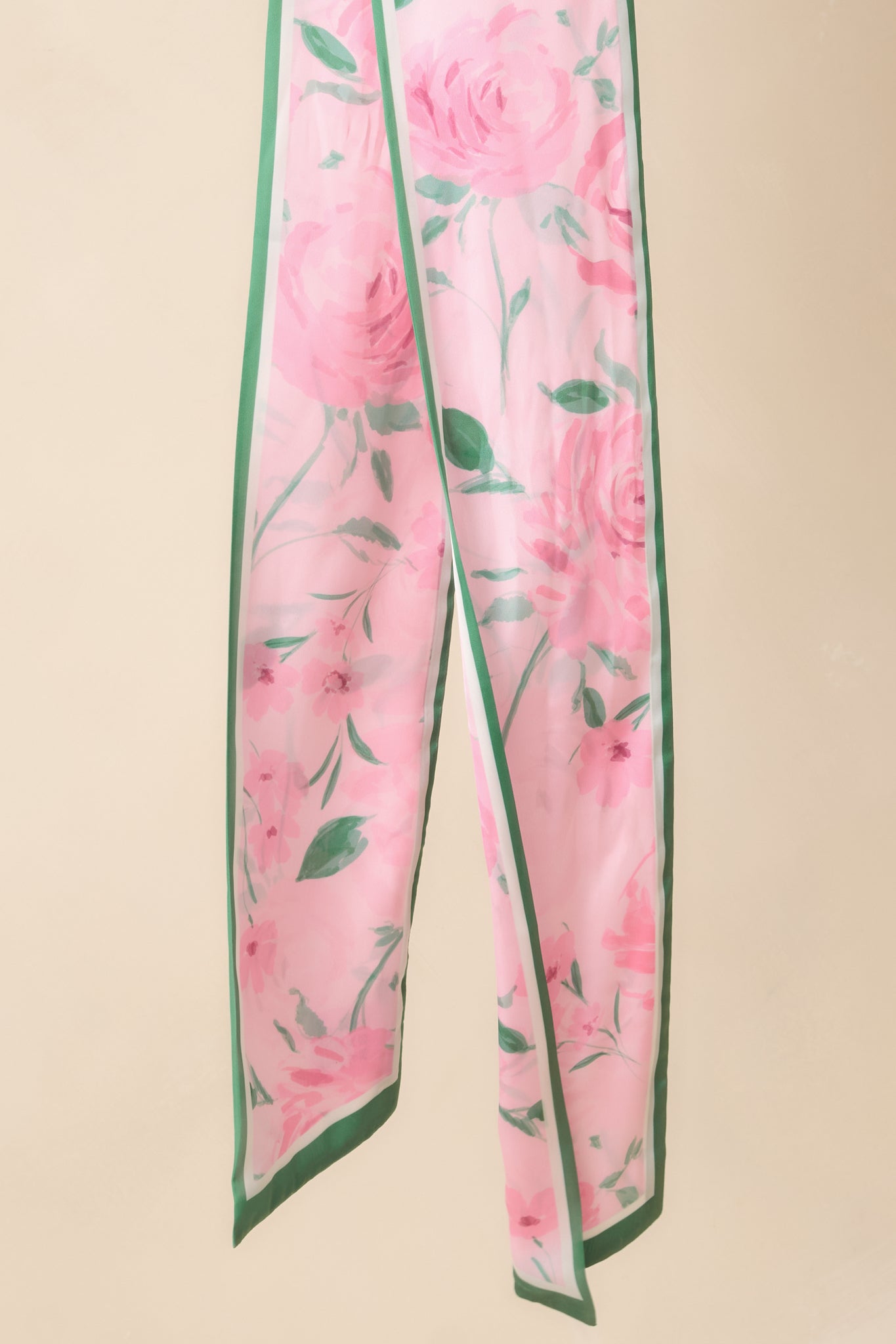 Cropped view focusing on the pink and green color combination and lightweight silky texture.