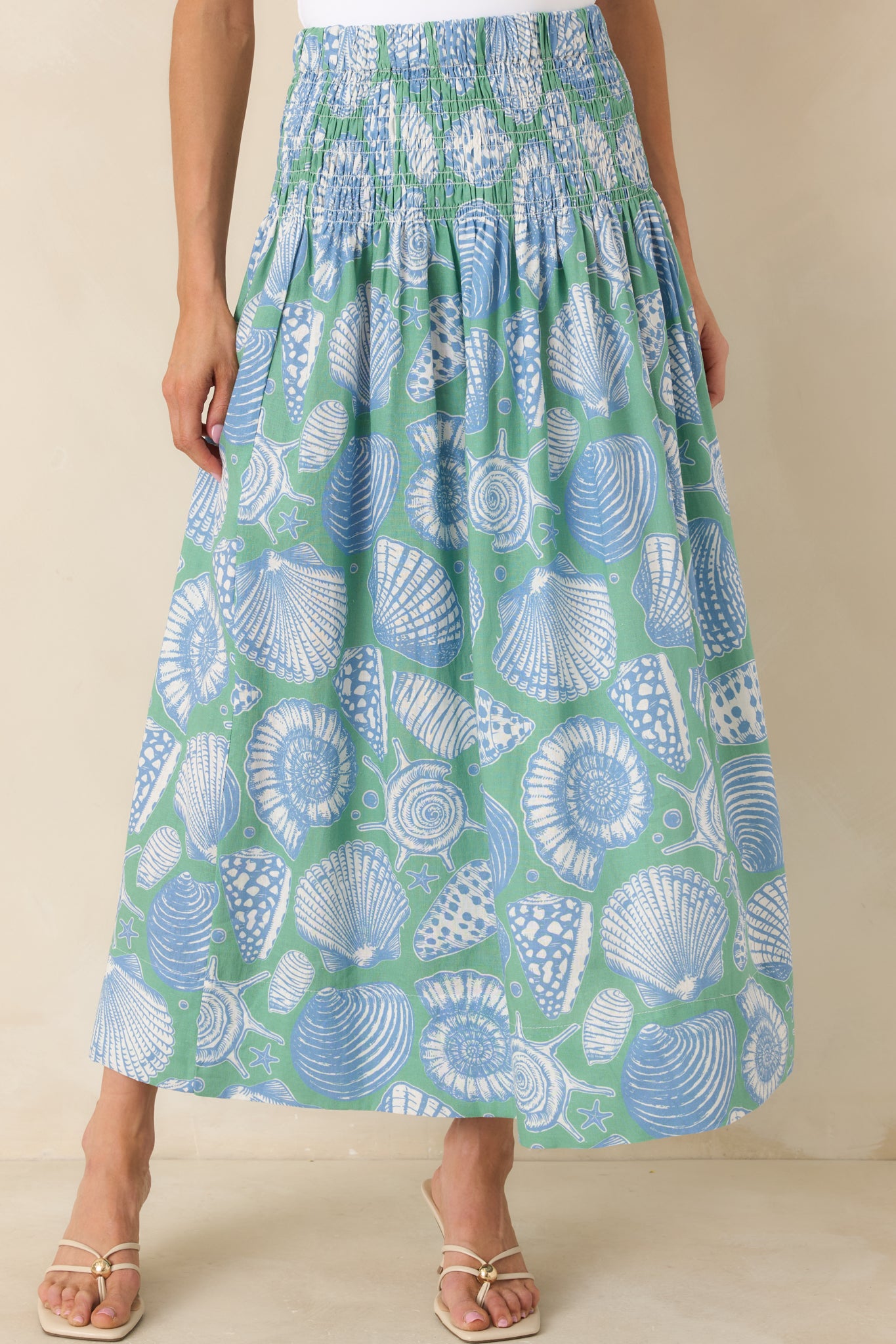 Another close cropped shot featuring the piece being worn as a skirt, highlighting the shell print and maxi length.
