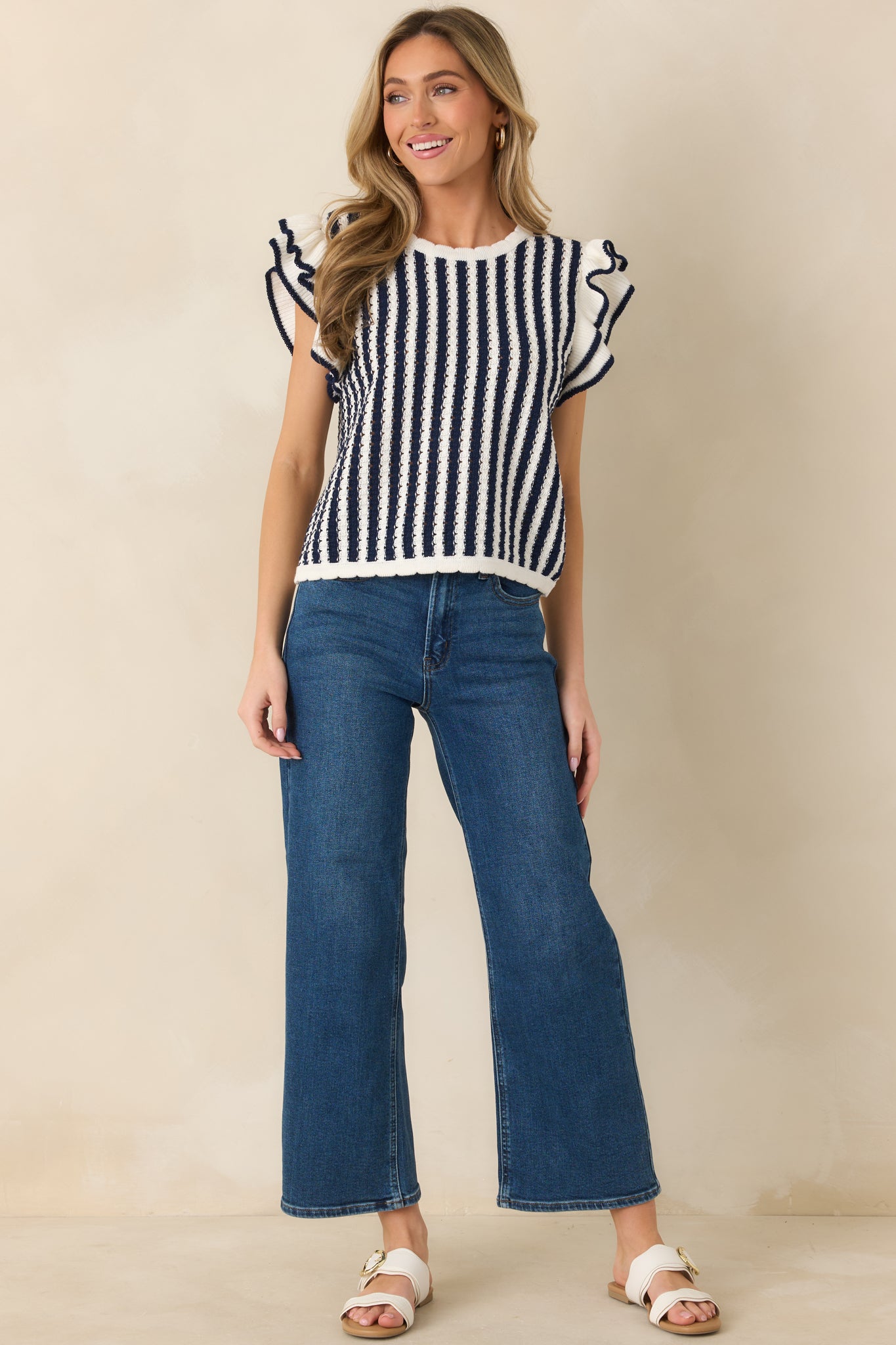 Crew neck striped top with flutter sleeves and clean, straight silhouette.