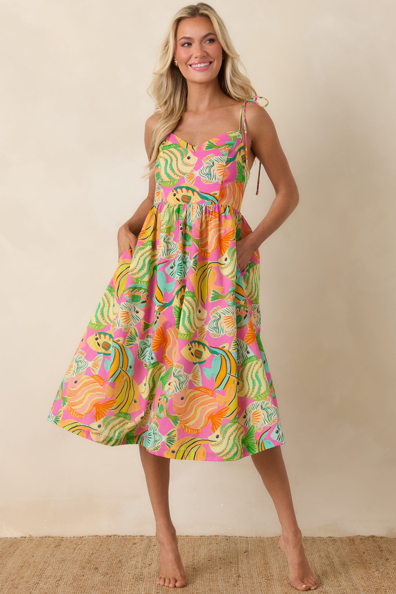 Midi dress with relaxed skirt, softly gathered bodice, and whimsical resort-ready print.