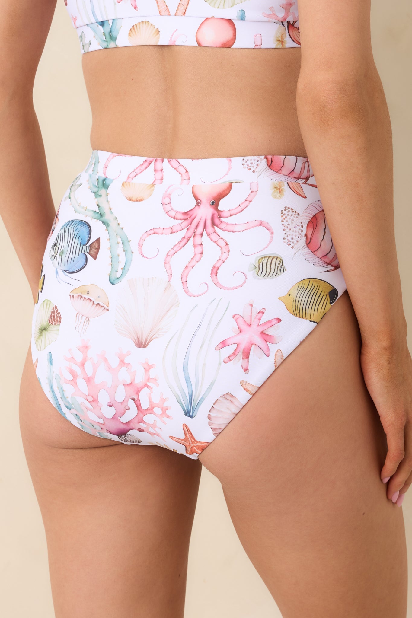 Rear view of multicolored bikini bottoms showing moderate coverage and high-rise smoothing waistband.
