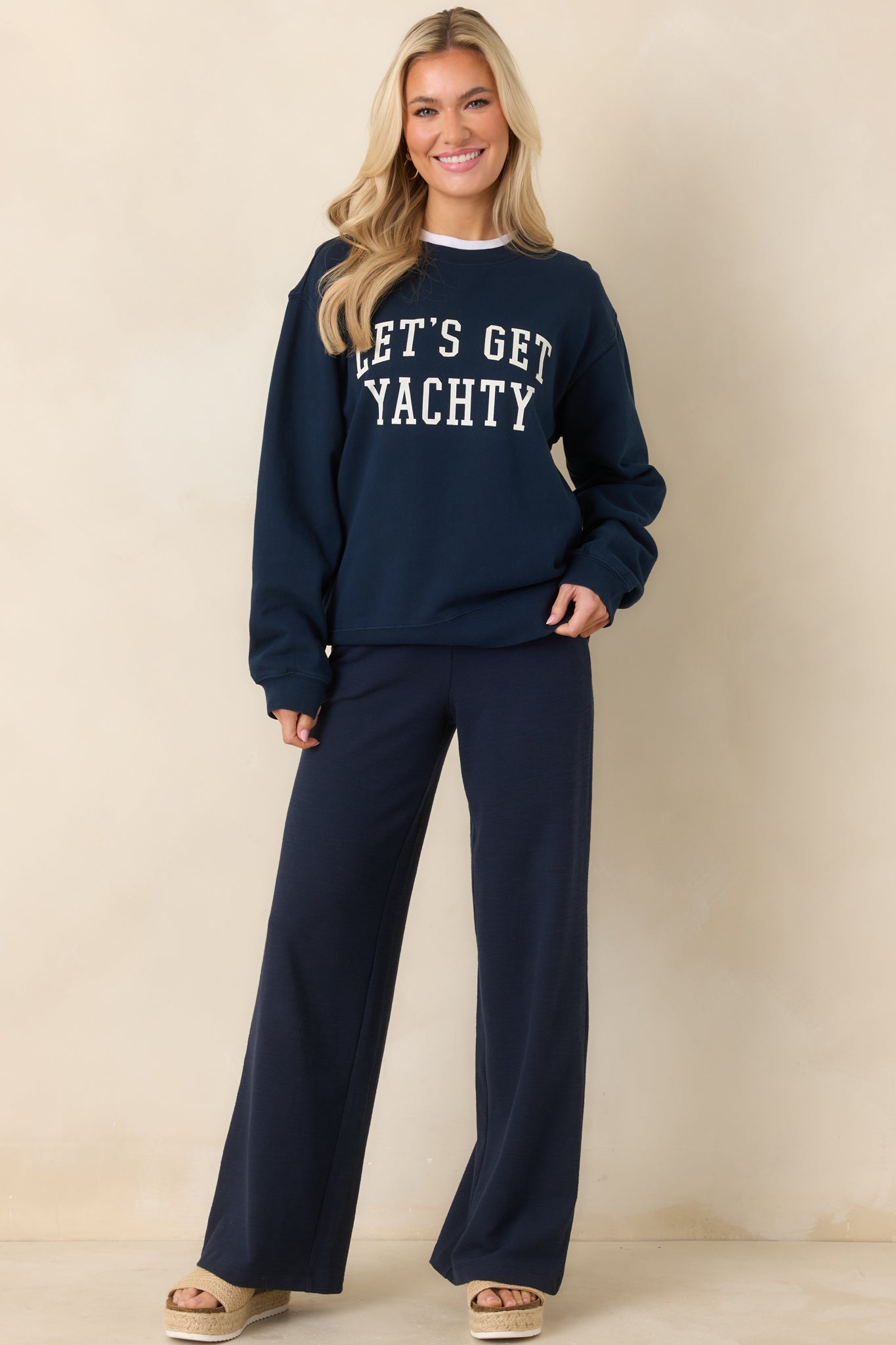 Front view of the knit navy pants showcasing soft drape and easy pull-on fit.