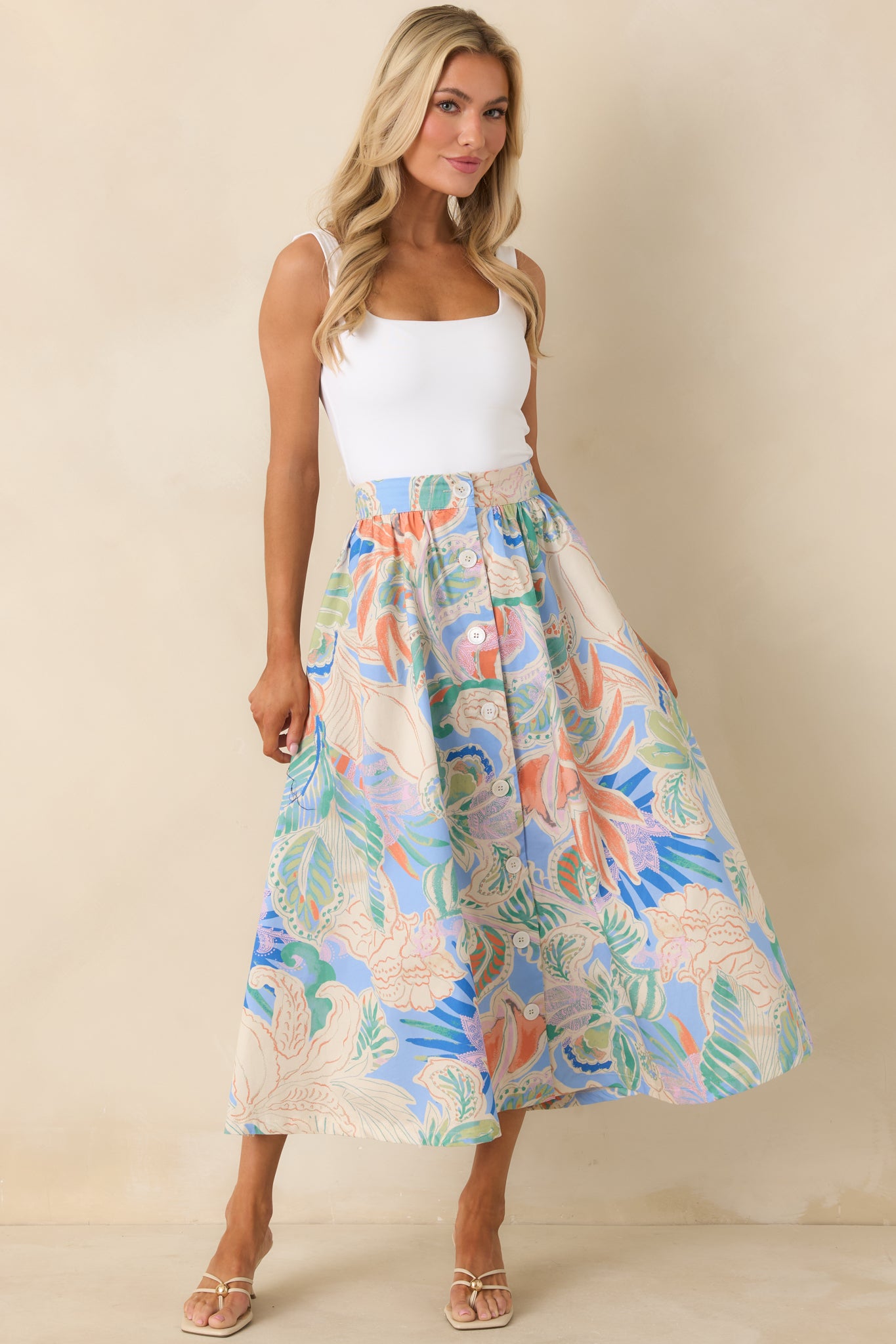 Maxi skirt with full button-front placket, structured waist, and softly gathered A-line silhouette.