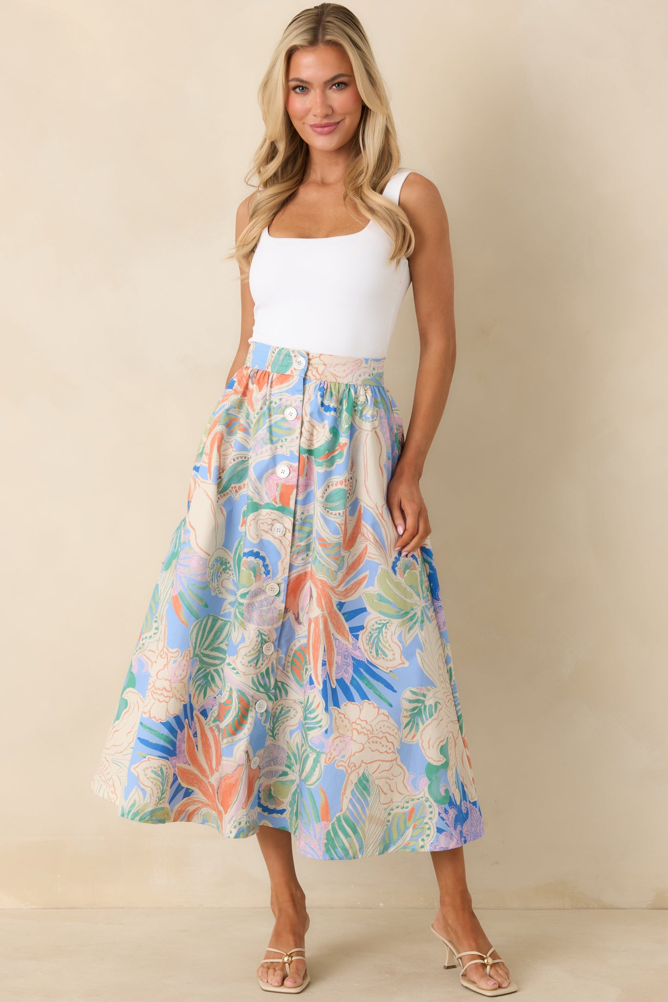 A-line maxi skirt featuring a streamlined waist and front buttons creating a classic elongated look.